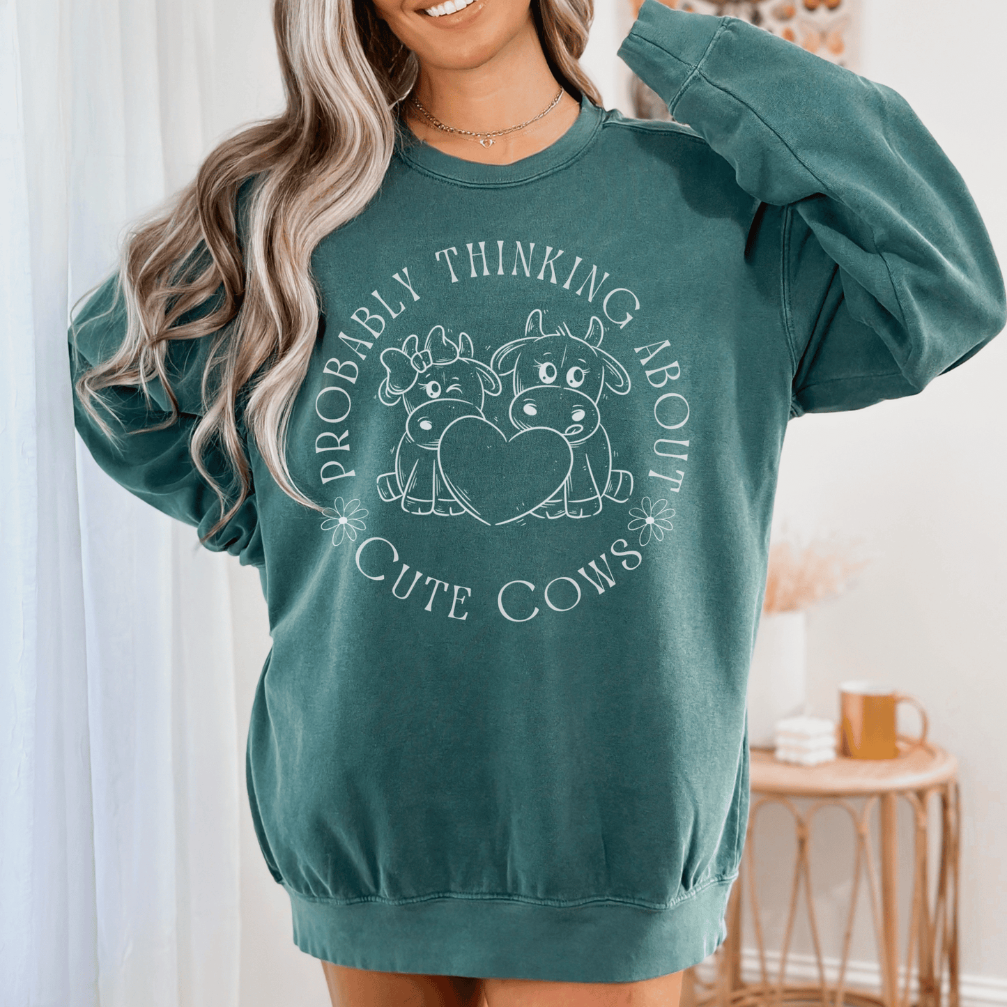 Cute cows surrounded by the saying Probably thinking about cute cows on a comfort colors sweatshirt.