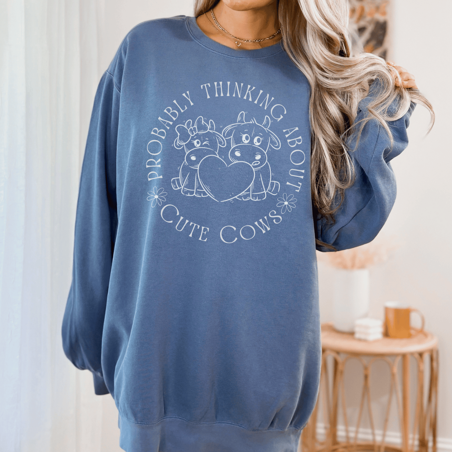 Cute cows surrounded by the saying Probably thinking about cute cows on a comfort colors sweatshirt.