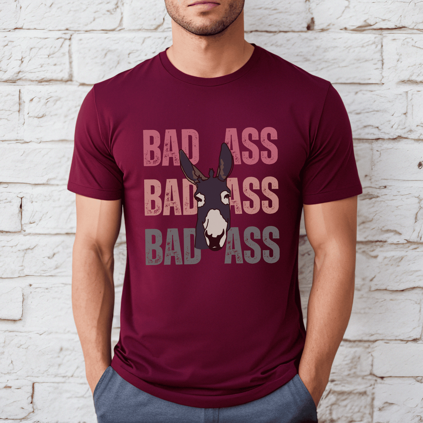 Cute distressed  vintage colored font that says Bad Ass with a donkey on a crewneck t-shirt.