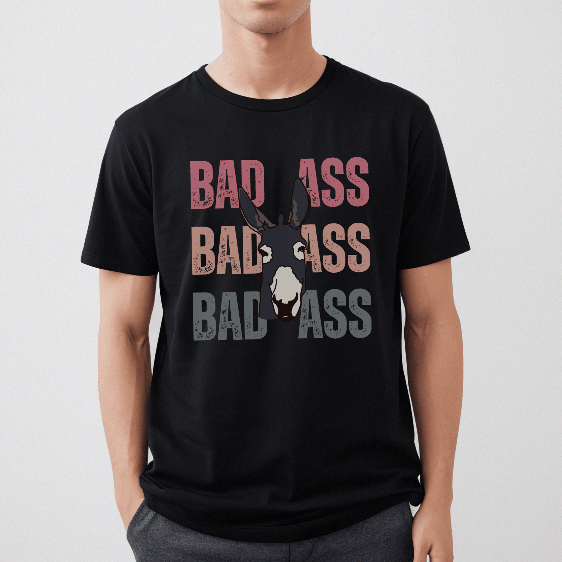 Cute distressed  vintage colored font that says Bad Ass with a donkey on a crewneck t-shirt.