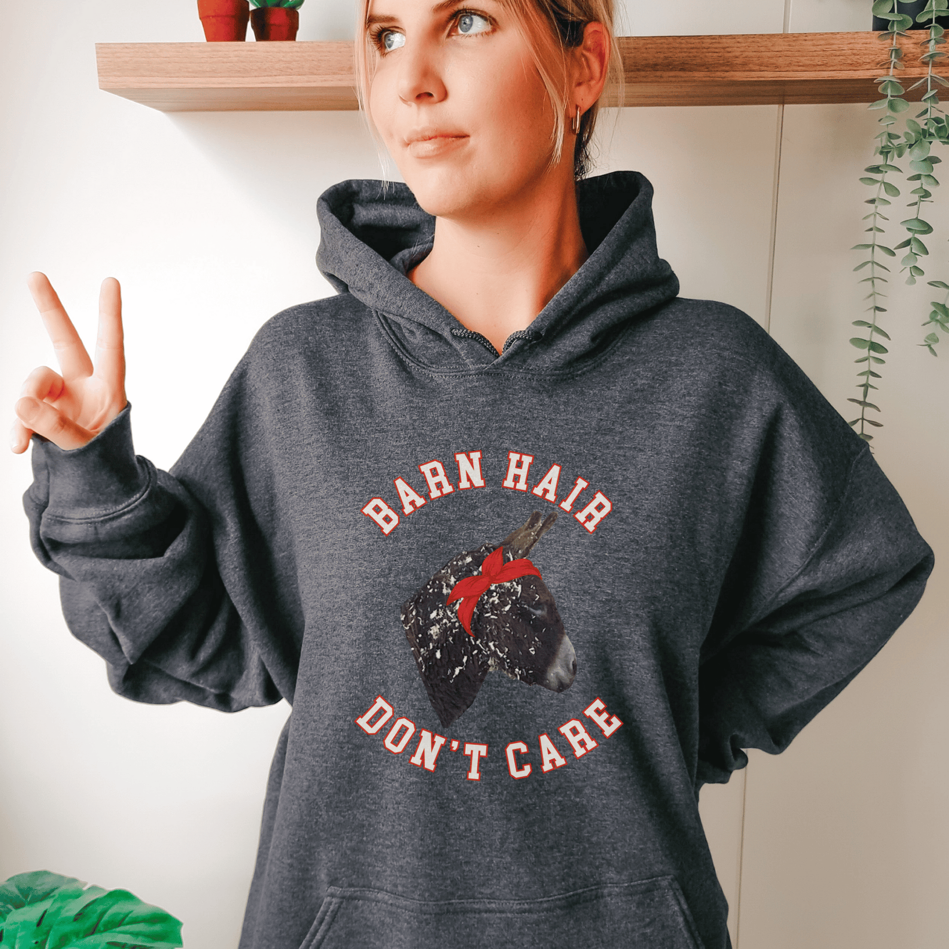 Cute Donkey covered in shavings hoodie! Perfect for horse and donkey lovers alike, this cozy hoodie features a charming Donkey design surrounded by wood shavings, alongside the empowering message Barn Hair, don't care.