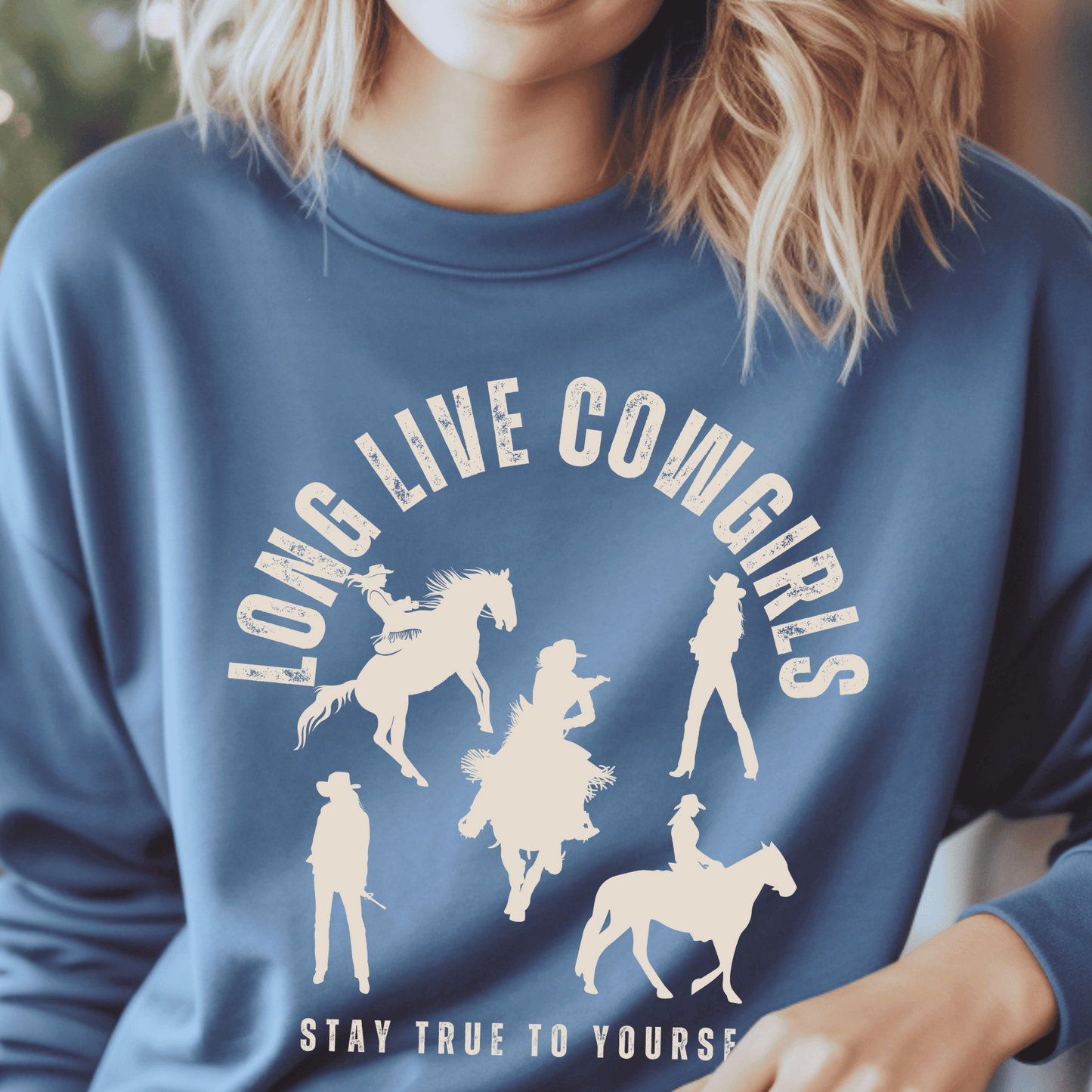 Crew neck sweatshirt with the saying Long Live Cowgirls stay true to yourself with five silhouettes of cowgirls.