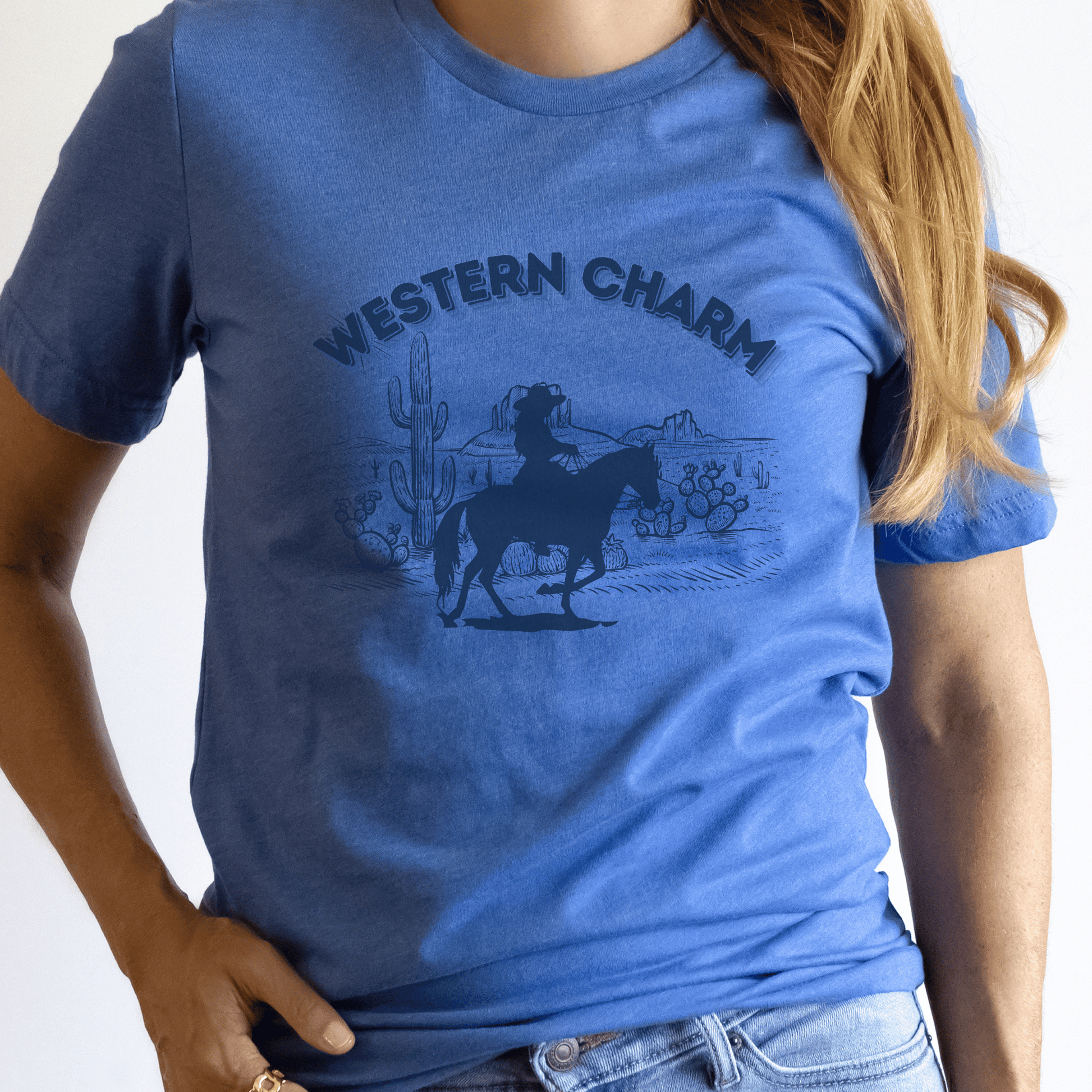 This crew neck t-shirt features a stunning western style print proudly showcasing the words western charm. Crafted from quality materials, this t-shirt is not only trendy but also super soft and breathable, ensuring you stay comfortable all day long.