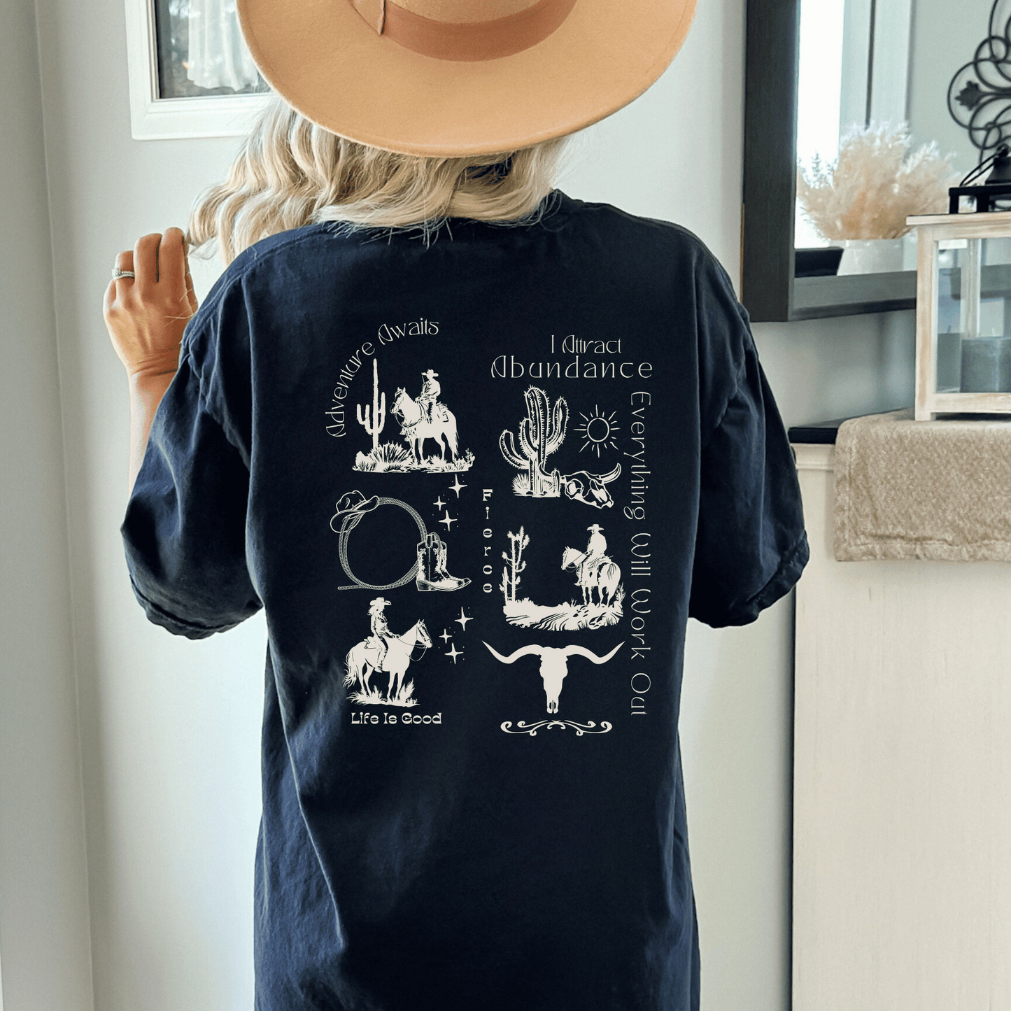 a trendy western design on the back of a comfort colors tee! If you're a true lover of all things western, this is the perfect addition to your wardrobe. Our skilled artisans have carefully crafted a unique design that beautifully captures the essence of the Wild West. 