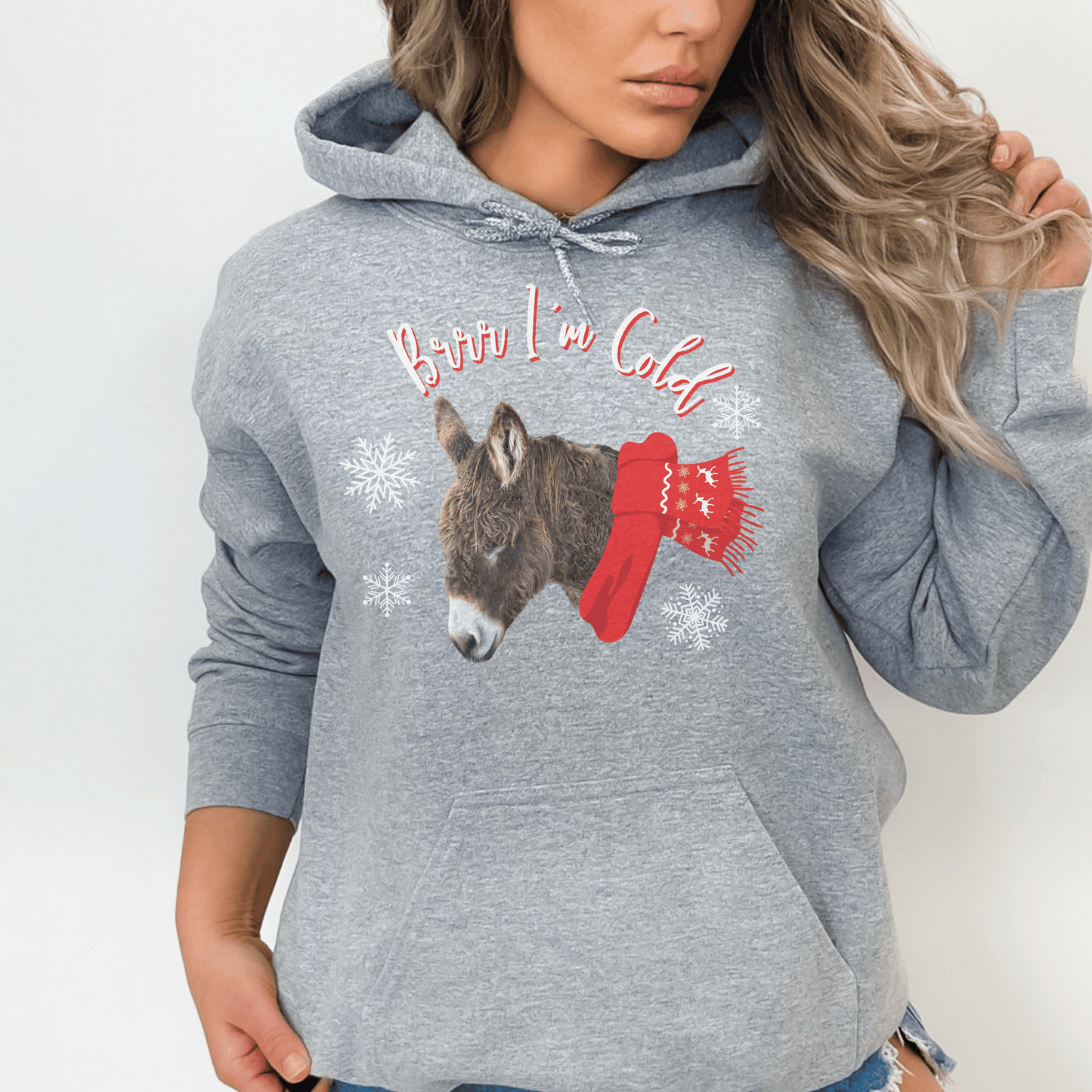 Our new Brr I'm Cold hoodie featuring a cute woolly donkey wearing a vibrant red scarf! This unique design combines the adorable charm of a donkey with the playful phrase Brr I'm Cold.&nbsp;