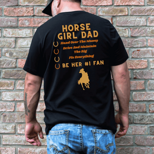 This t-shirt features the word "Dad" on the front and "Horse Girl Dad" on the back, along with the phrase "Hand Over the Money, Drive and Maintain the Rig, Fix Everything, and Be Her #1 Fan." It's a fun and playful way to show your love and support for your daughter's passion for horses.