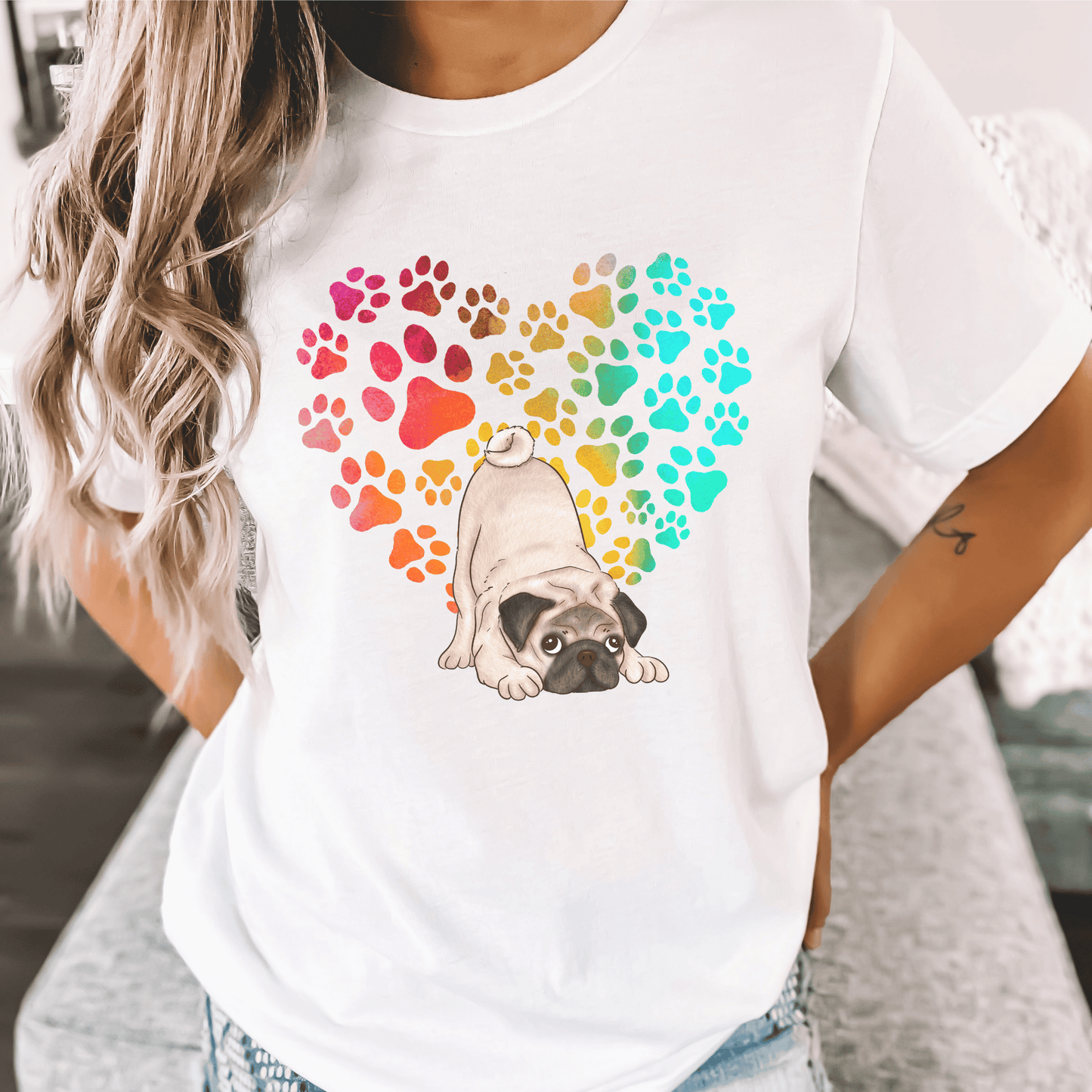 This Pug Dog t-shirt features a paw print heart in the background, making it a unique and thoughtful gift for dog lovers, pet owners, and Pug moms. The shirt is perfect for anyone who wants to show off their love for their furry friend.