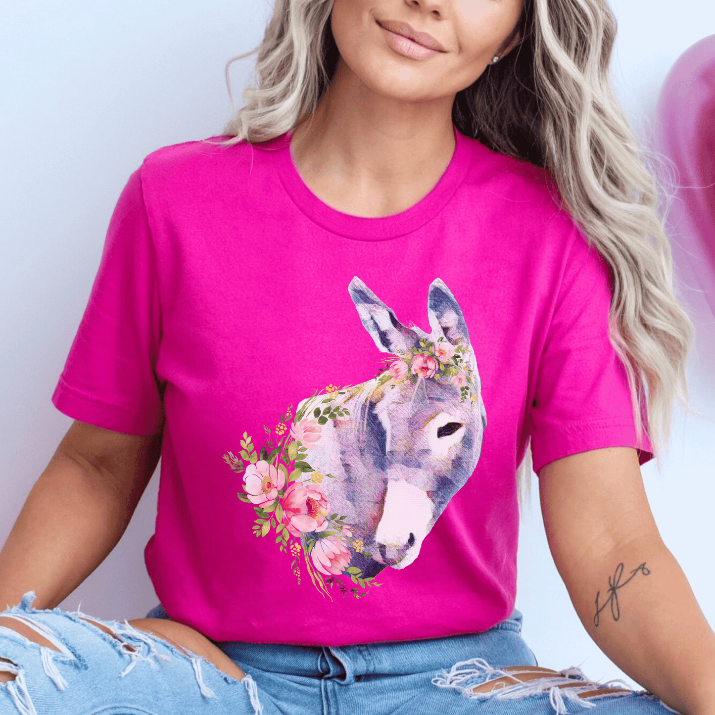 A pastel donkey and flowers design on a crew neck t-shirt.