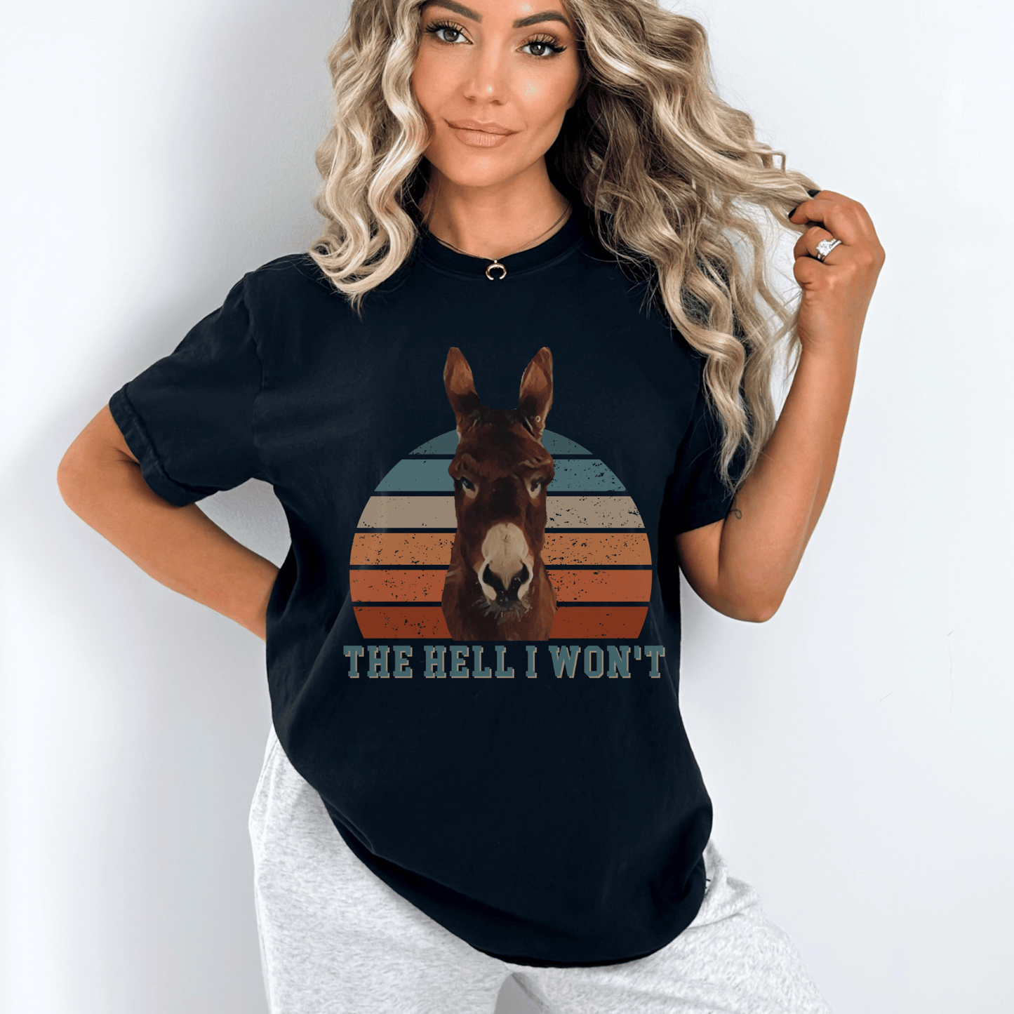  Cute Donkey t-shirt, designed for those who love a touch of sass! Featuring the saying Hell I won't below a sassy donkey, this shirt is perfect for expressing your bold and confident personality. Made from premium quality materials, this t-shirt is not only stylish but also comfortable to wear.