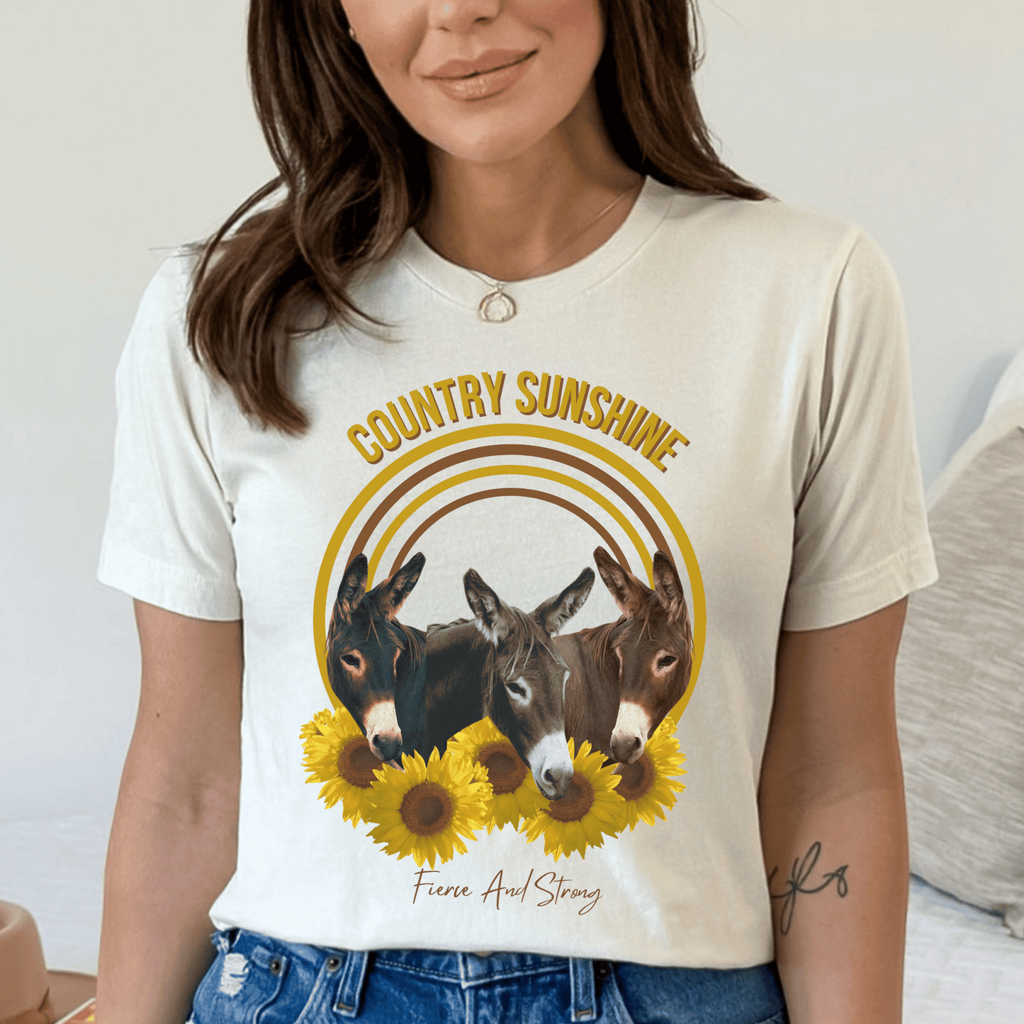 charming t-shirt featuring three adorable donkeys surrounded by vibrant sunflowers! This delightful design captures the essence of country sunshine, making it the perfect addition to your casual wardrobe.