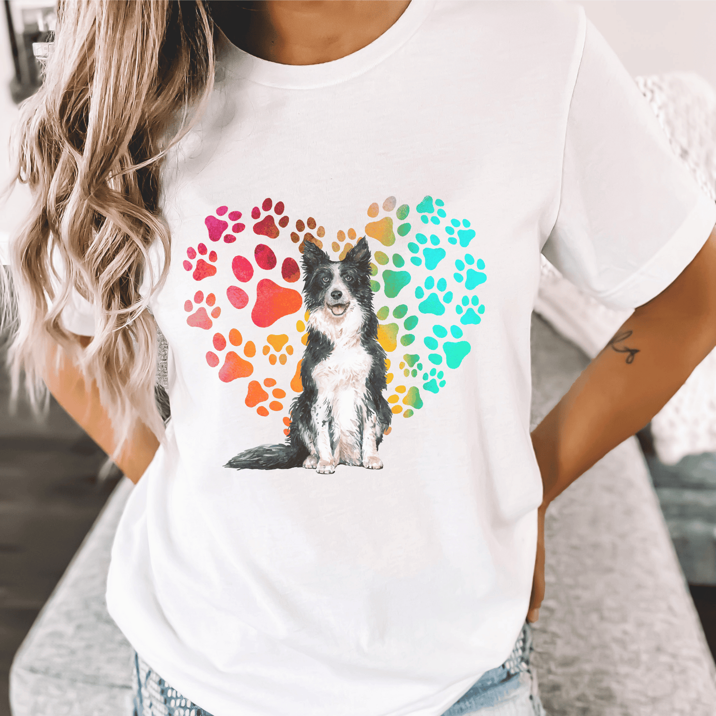 This Border Collie Dog t-shirt features a paw print heart in the background, making it a unique and thoughtful gift for dog lovers, pet owners, and Border Collie moms. The shirt is perfect for anyone who wants to show off their love for their furry friend.