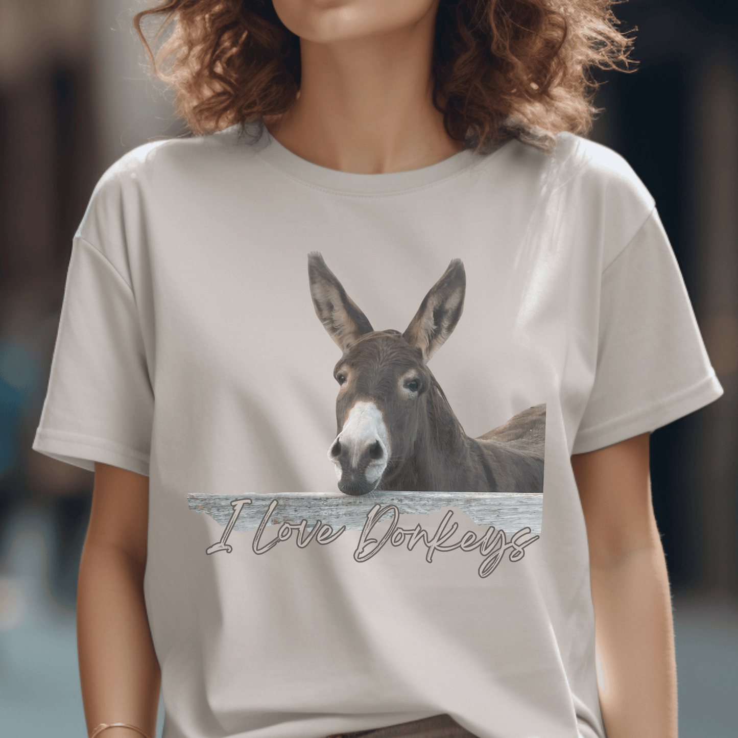 Cute Donkey looking over the fence with I love dokeys printed below it on a crew neck t-shirt