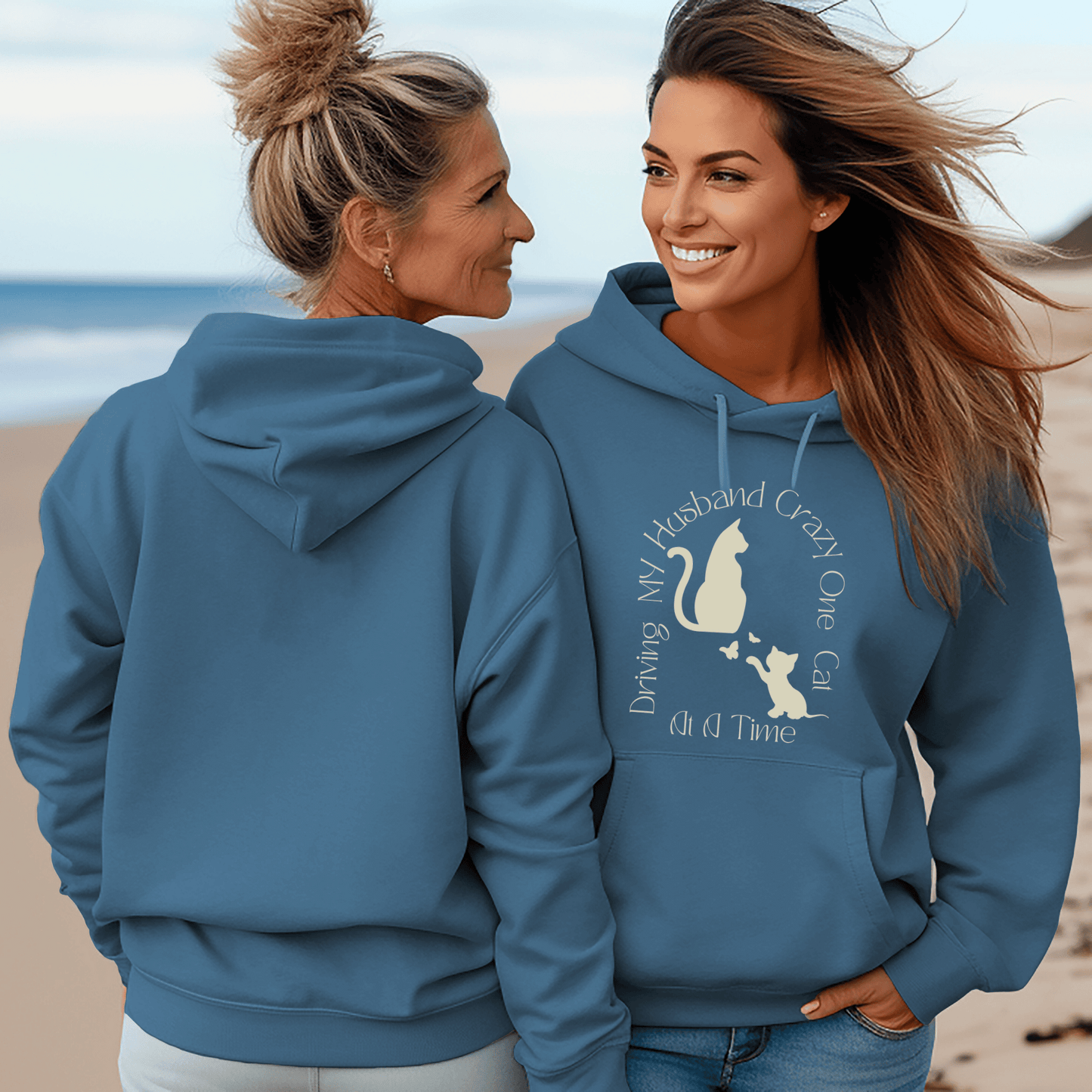 Hoodie sweatshirt with cats on the front and the saying Driving My husband crazy one cat at a time on the front.