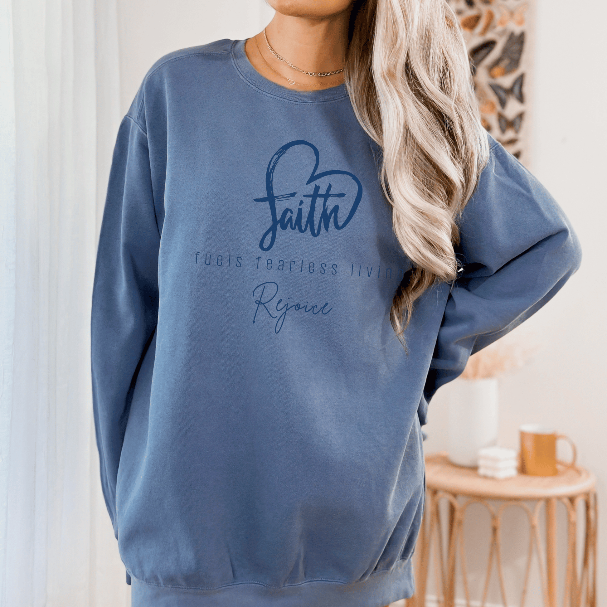 Faith Fuels Fearless living Christian Saying on a Comfort Colors Crew neck sweatshirt.