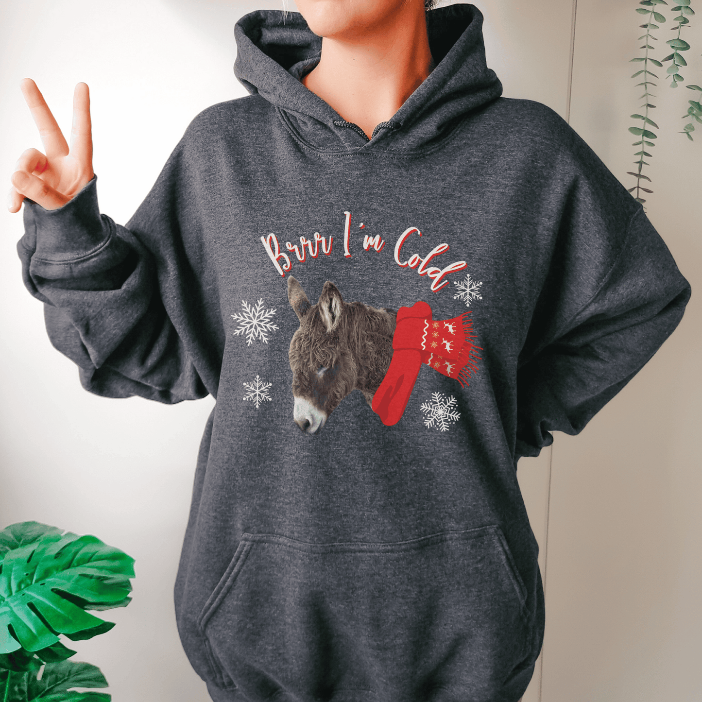 Our new Brr I'm Cold hoodie featuring a cute woolly donkey wearing a vibrant red scarf! This unique design combines the adorable charm of a donkey with the playful phrase Brr I'm Cold.&nbsp;