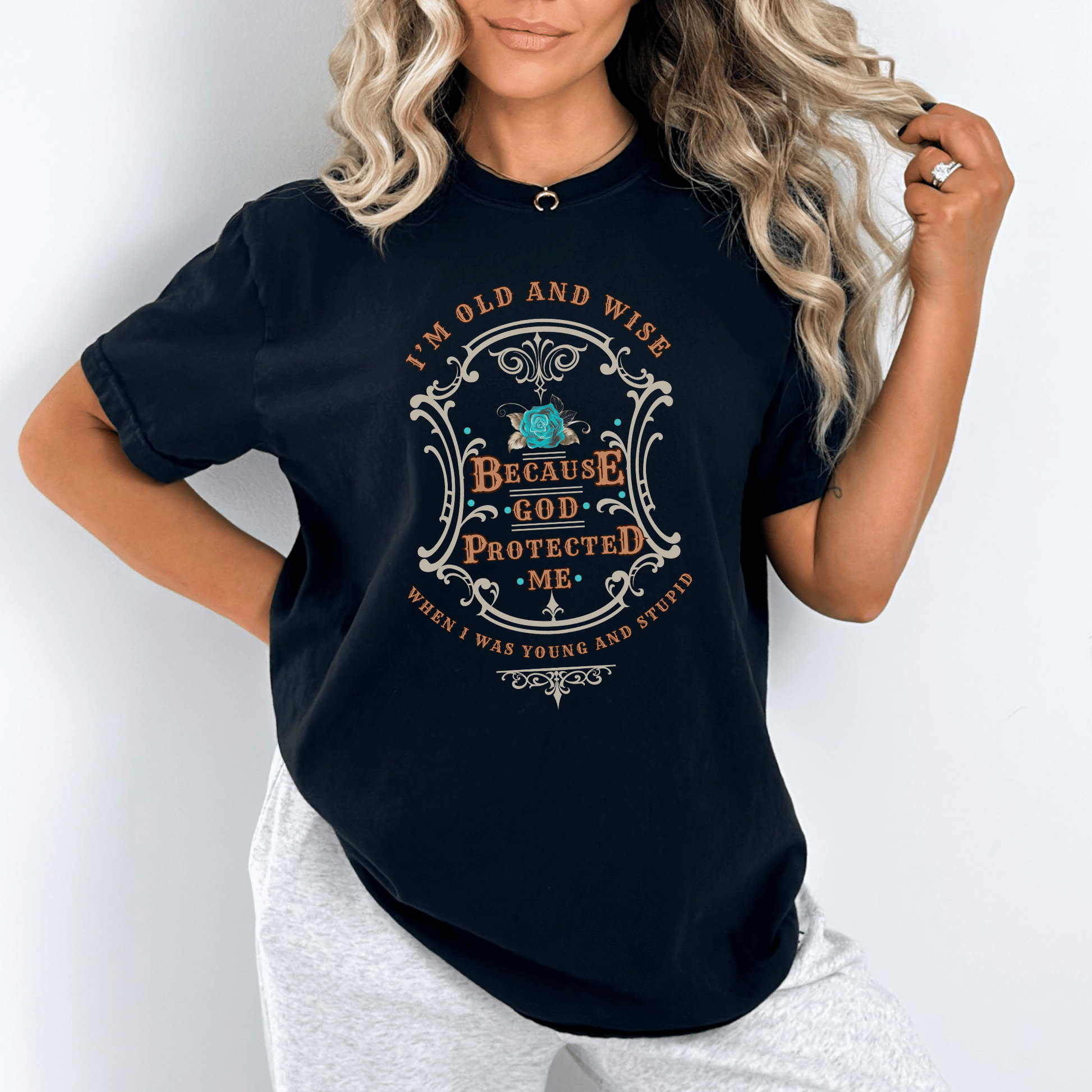 Funny t-shirt that perfectly captures the wisdom that comes with age and the protection of God! This witty shirt features the humorous phrase old and wise because God protected me when I was young and stupid.