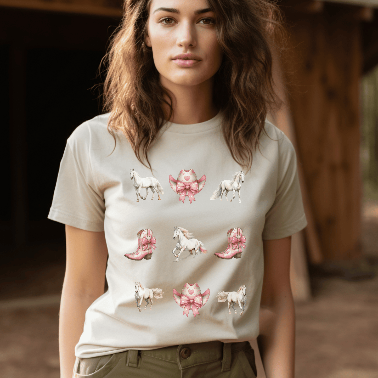 A Coquette cowgirl design with white horses and pink cowboy boots and cowboy hats on a cute t-shirt.