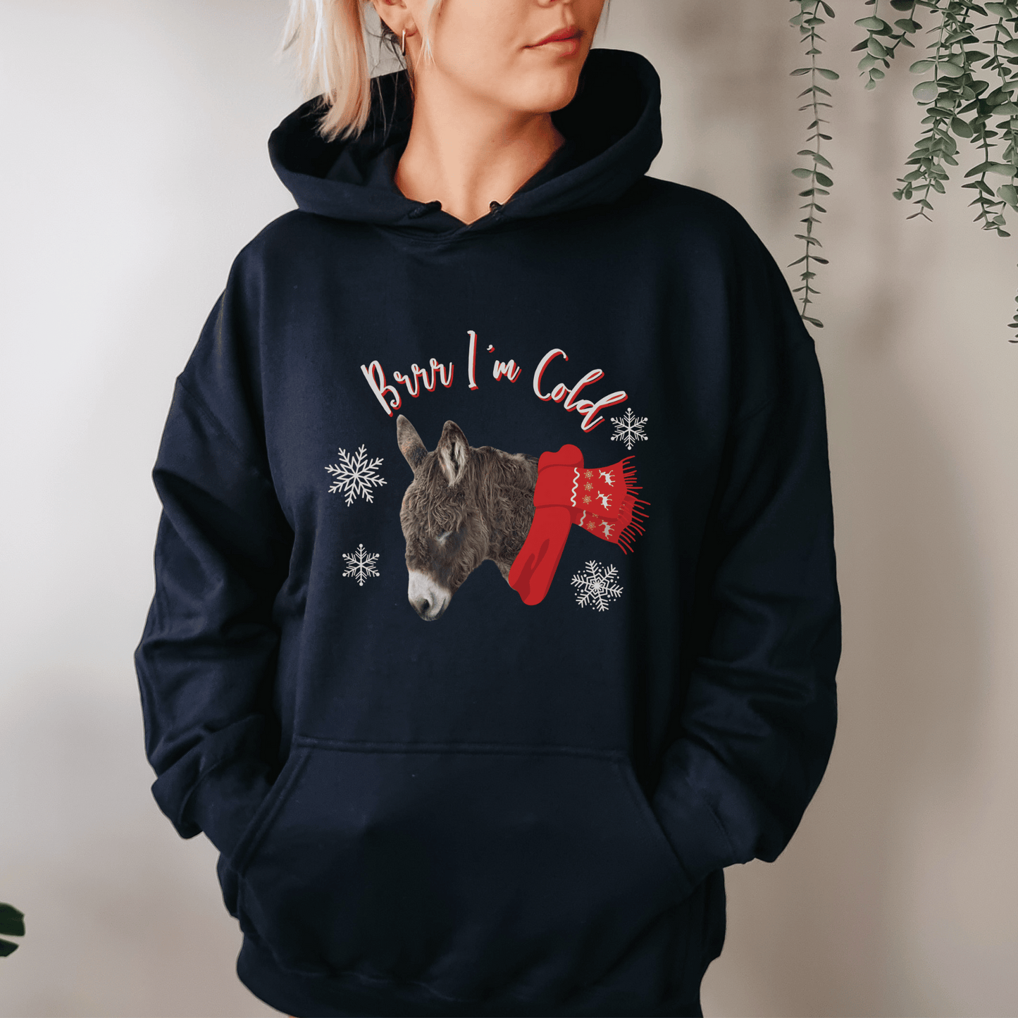 Our new Brr I'm Cold hoodie featuring a cute woolly donkey wearing a vibrant red scarf! This unique design combines the adorable charm of a donkey with the playful phrase Brr I'm Cold.&nbsp;