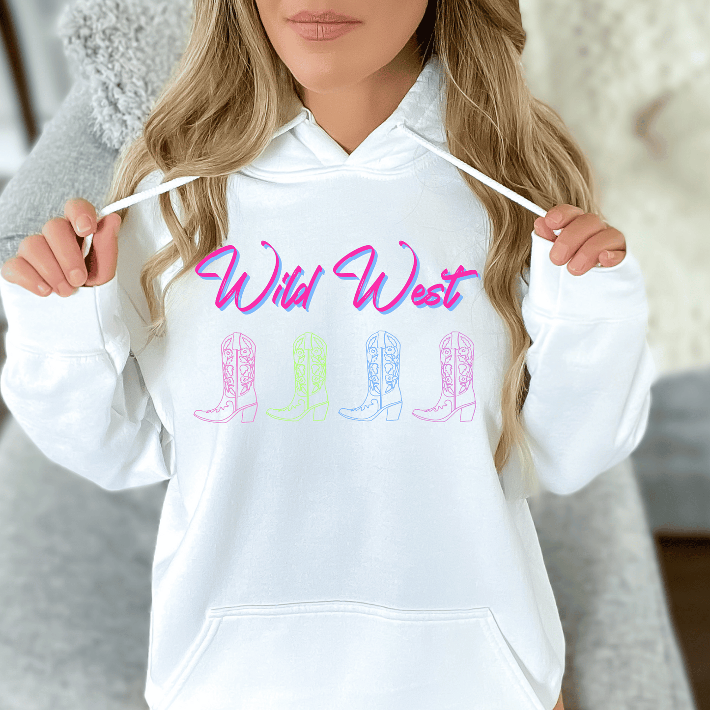 Wild West Neon Cowboy Boot Hoodie, the perfect blend of Western charm and vibrant style! This hoodie showcases a bold neon cowboy boot design that is sure to turn heads wherever you go.