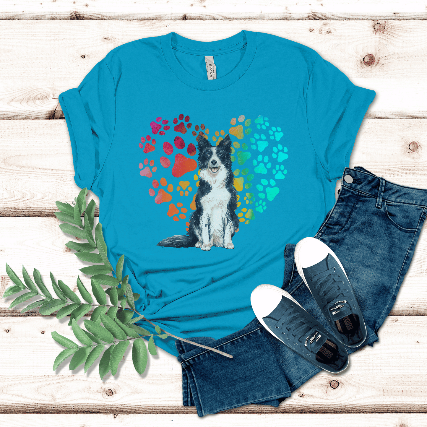 This Border Collie Dog t-shirt features a paw print heart in the background, making it a unique and thoughtful gift for dog lovers, pet owners, and Border Collie moms. The shirt is perfect for anyone who wants to show off their love for their furry friend.