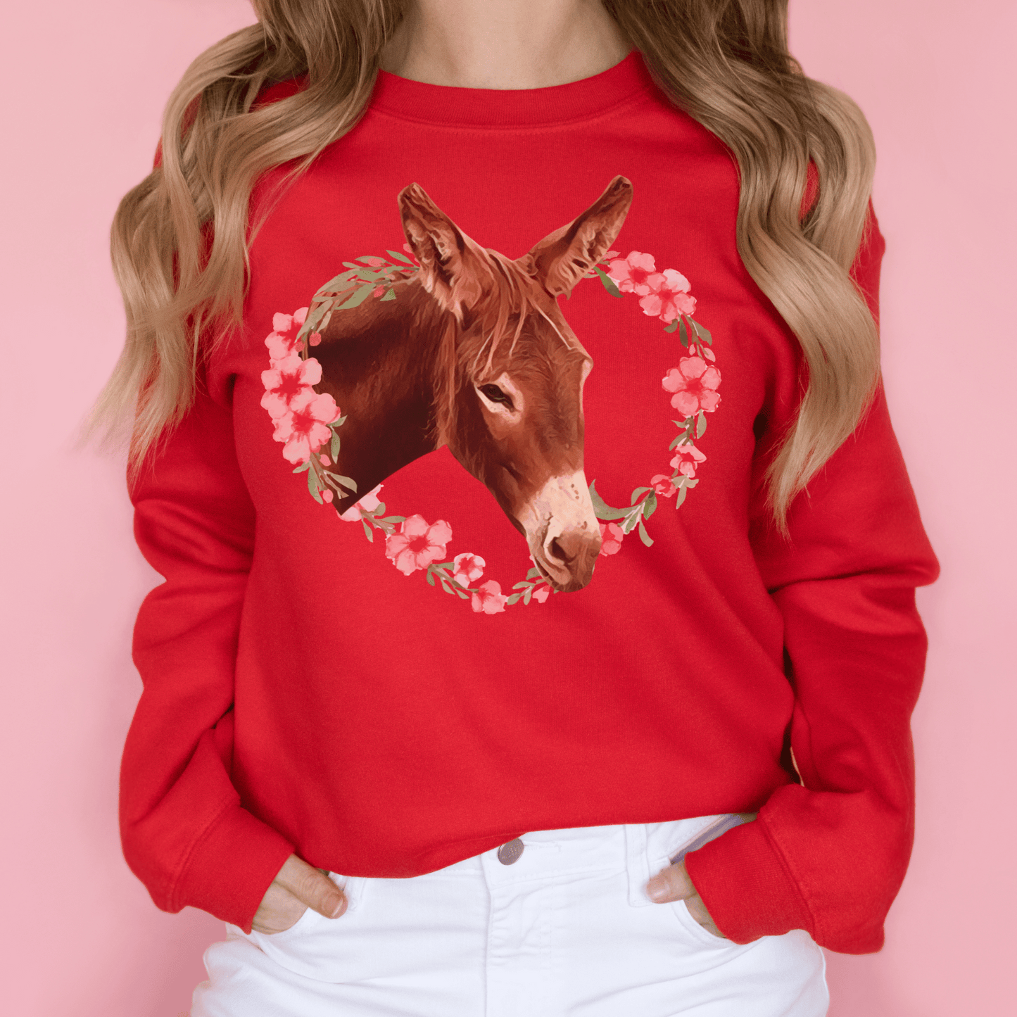 Crew neck sweatshirt with a cute donkey  surrounded by a pink flower wreath.