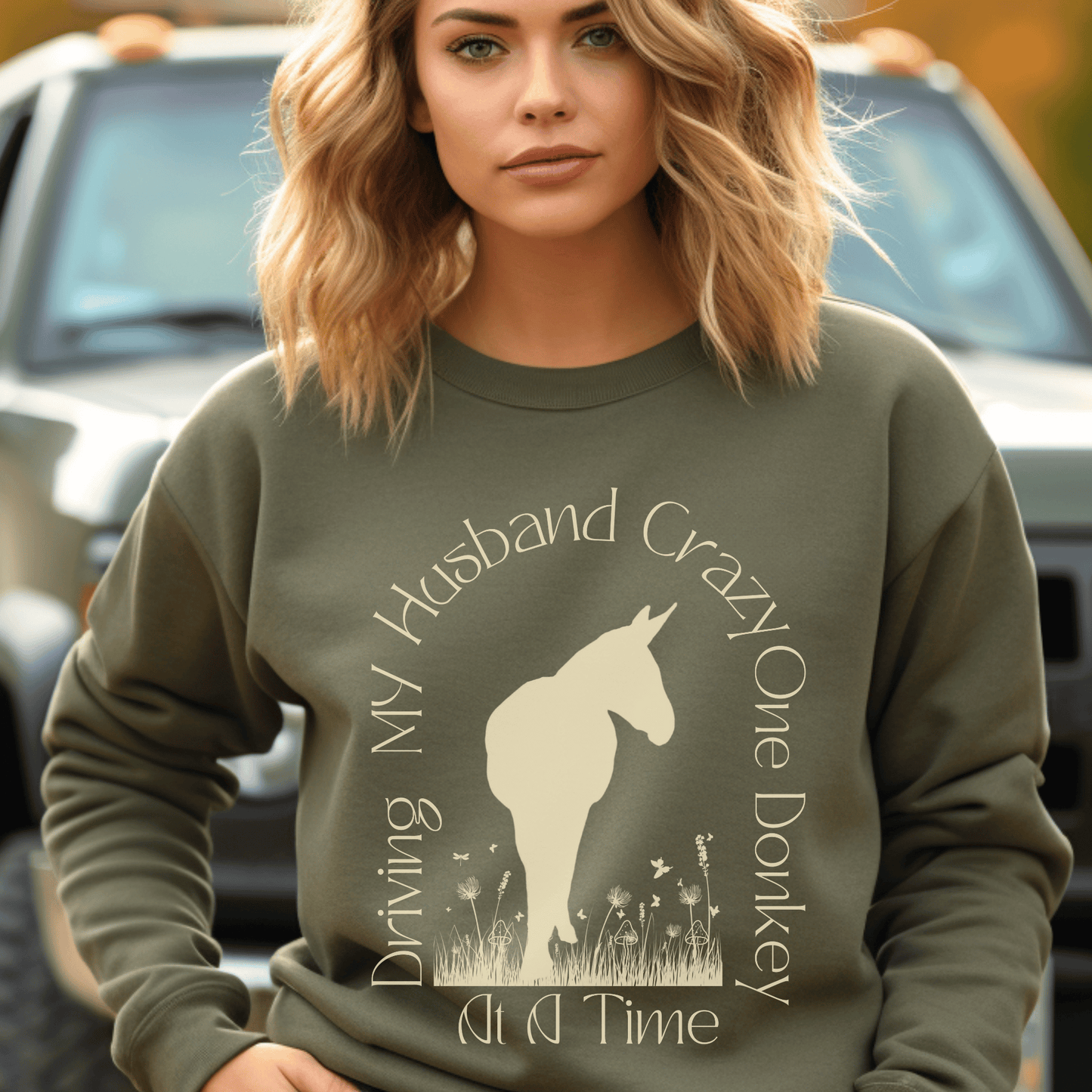 Driving My Husband Crazy One Donkey at a Time Crew Neck Sweatshirt! Show off your playful side with this fun and whimsical design that is bound to turn heads. Crafted with a premium quality blend of fabrics, this sweatshirt ensures maximum comfort and durability.