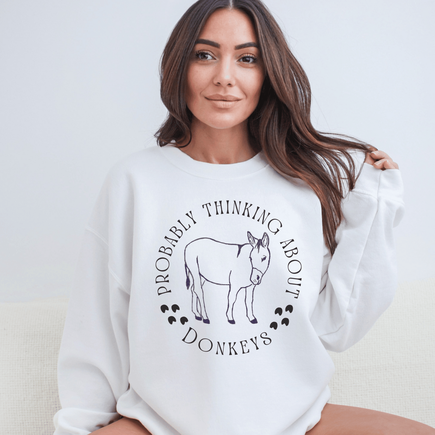 Probalby thinking about Donkeys with a cute outline of a donkey on a crewneck sweatshirt.