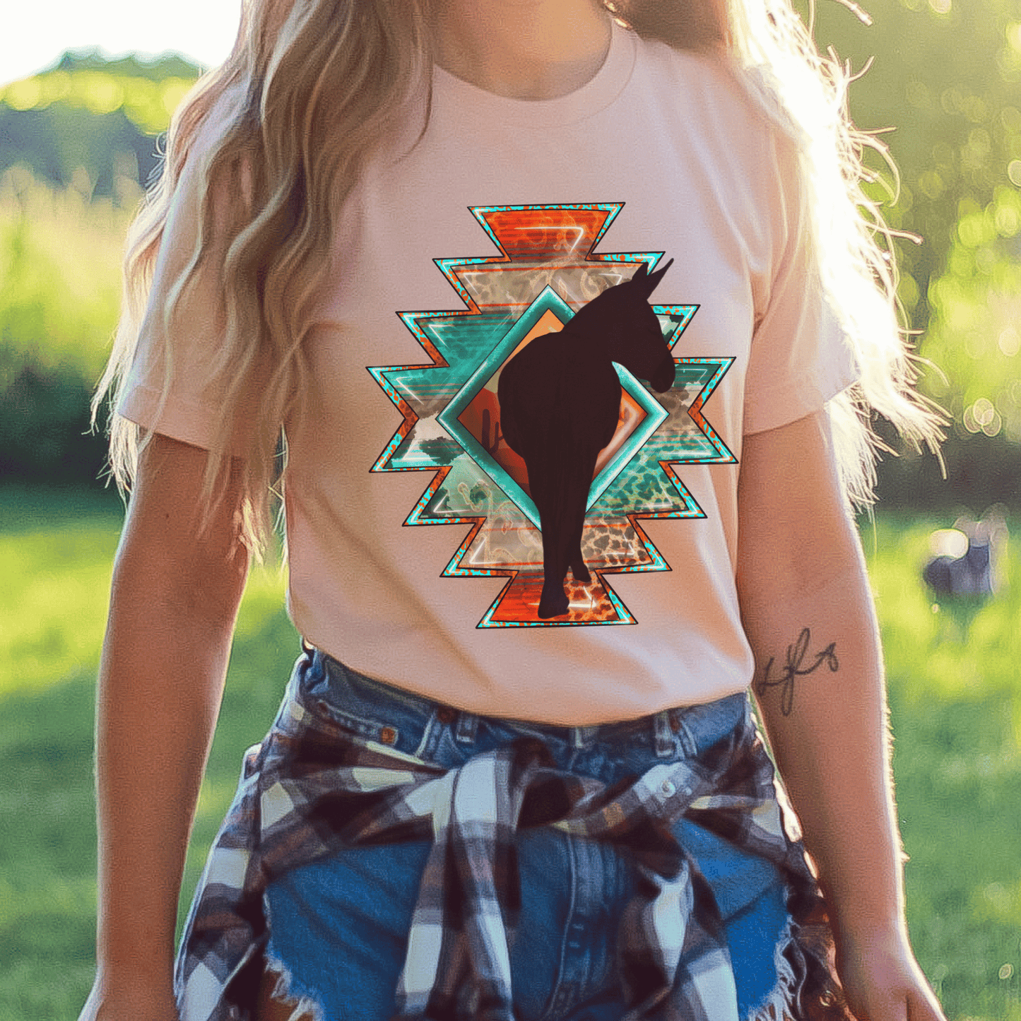  Southwestern-style graphic tee featuring a charming donkey silhouette! This shirt is perfect for animal lovers and those who embrace a farm, ranch, or country lifestyle. If you're a donkey enthusiast, this shirt is a must-have! Show off your love for these adorable animals or surprise a fellow donkey lover with a thoughtful gift from our donkey collection.