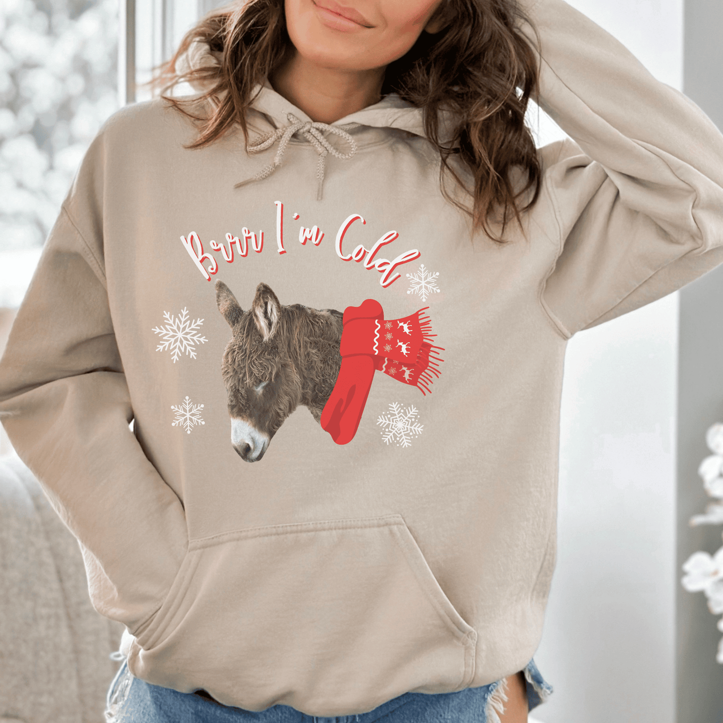 Our new Brr I'm Cold hoodie featuring a cute woolly donkey wearing a vibrant red scarf! This unique design combines the adorable charm of a donkey with the playful phrase Brr I'm Cold.&nbsp;