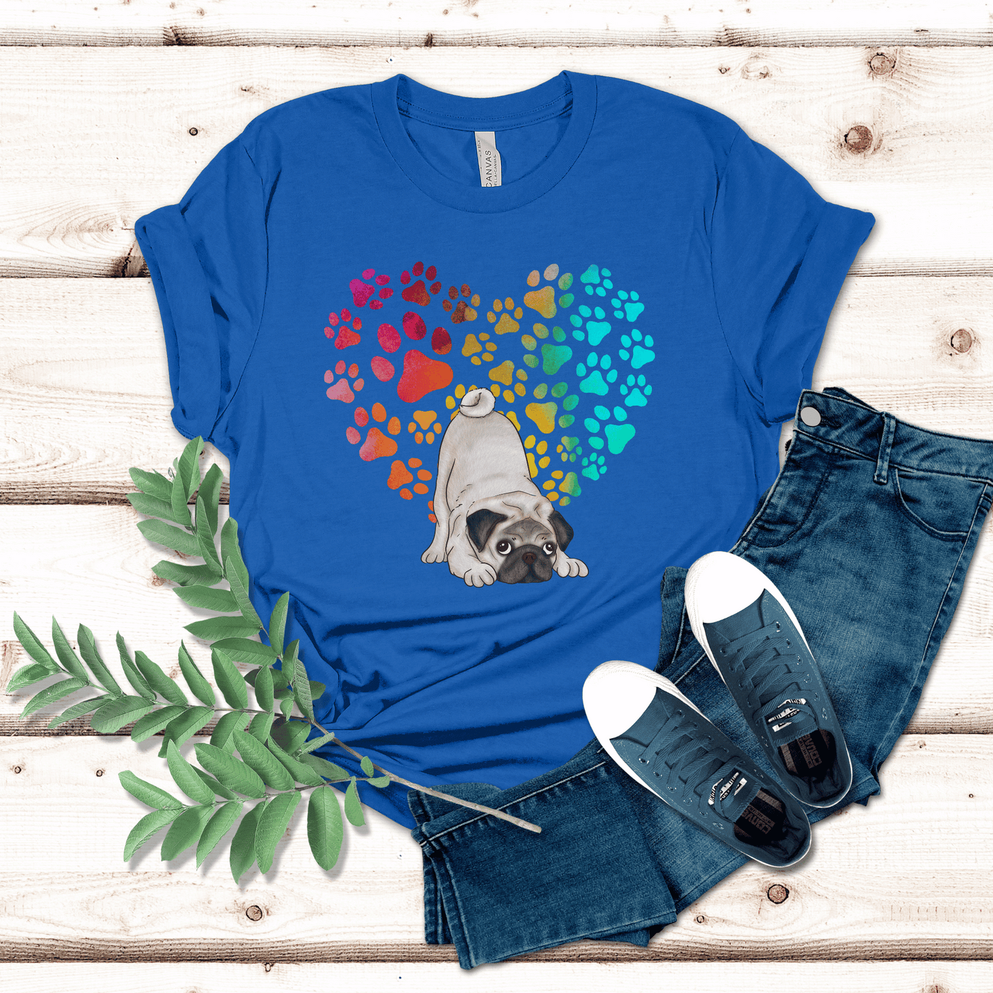 This Pug Dog t-shirt features a paw print heart in the background, making it a unique and thoughtful gift for dog lovers, pet owners, and Pug moms. The shirt is perfect for anyone who wants to show off their love for their furry friend.