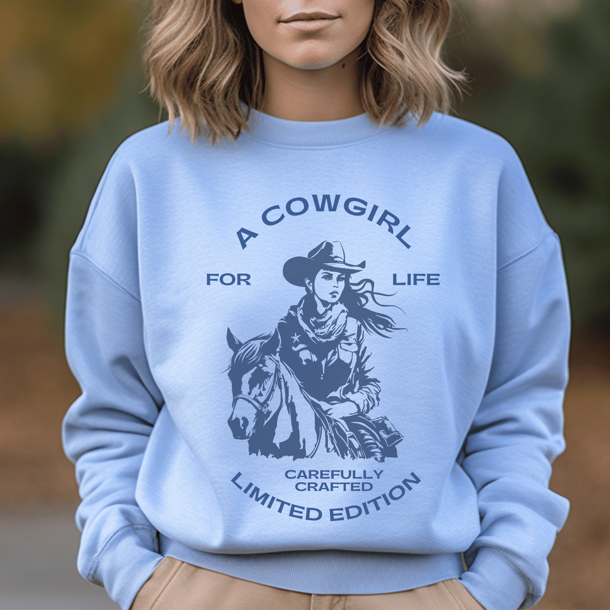 versatile sweatshirt features a bold and empowering statement that showcases your love for the cowgirl lifestyle. Whether you're out on the ranch, riding your favorite horse, or simply rocking a casual yet chic look, this sweatshirt is a must-have addition to your wardrobe.