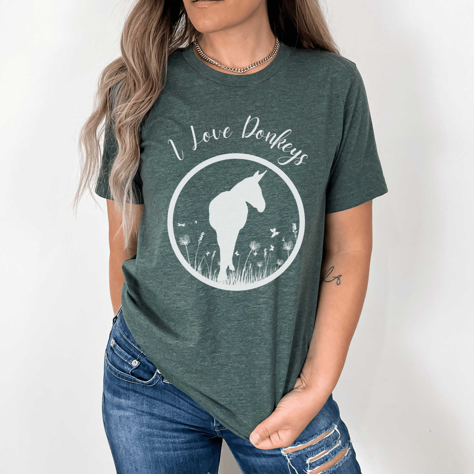 I love donkeys t-shirt is perfect for going anywhere or hanging out with your donkeys. This trend setting donkey design will make a great addition to your wardrobe and a unique gift for that special donkey loving person in your life. Everyone needs the perfect t-shirt to complement an everyday, laid-back look. The ideal top for so many occasions, this lightweight cotton tee will keep you comfy and looking smart.