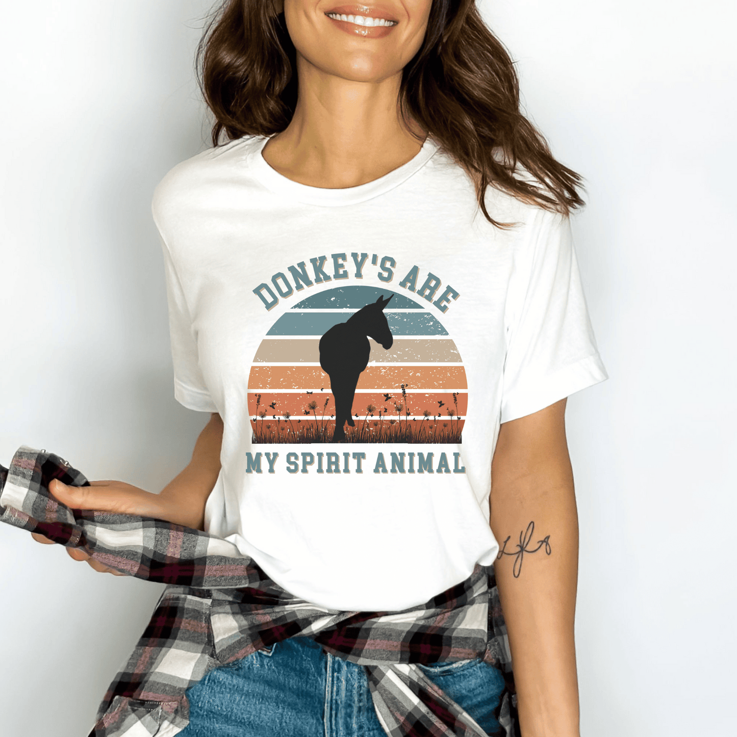 This unique piece features a charming donkey illustration on the front, perfectly capturing the spirit and beauty of these lovable creatures. The saying Donkeys are my spirit animal adds a touch of whimsy and showcases your love for these incredible animals.