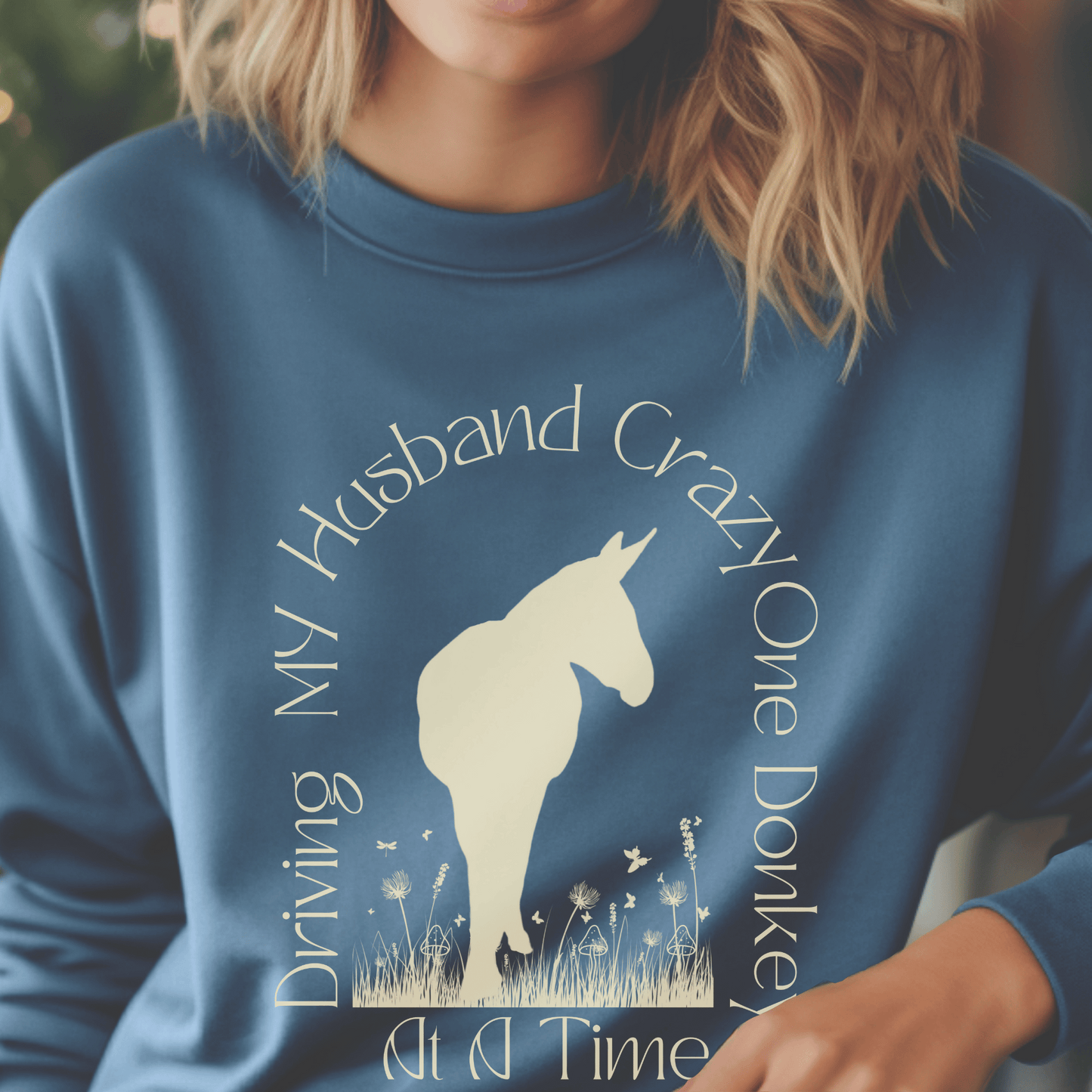 Driving My Husband Crazy One Donkey at a Time Crew Neck Sweatshirt! Show off your playful side with this fun and whimsical design that is bound to turn heads. Crafted with a premium quality blend of fabrics, this sweatshirt ensures maximum comfort and durability.