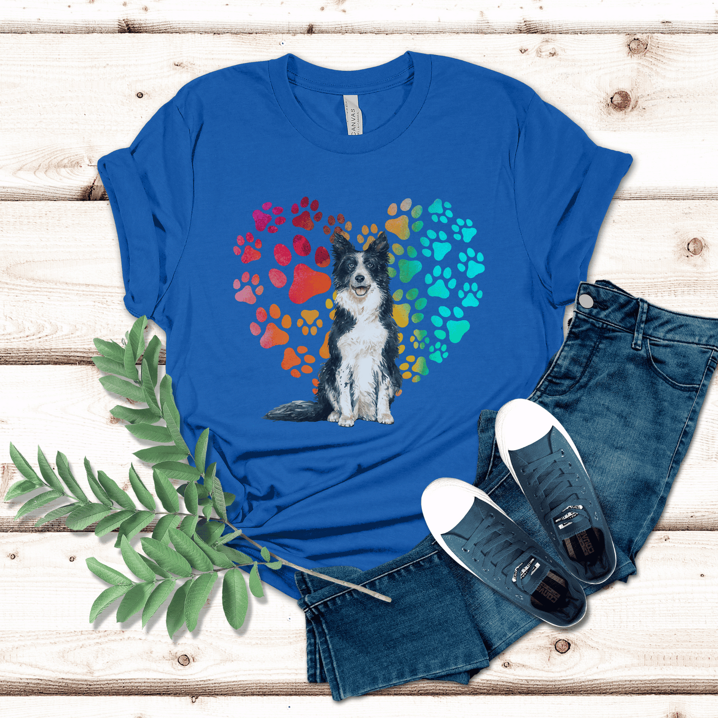 This Border Collie Dog t-shirt features a paw print heart in the background, making it a unique and thoughtful gift for dog lovers, pet owners, and Border Collie moms. The shirt is perfect for anyone who wants to show off their love for their furry friend.