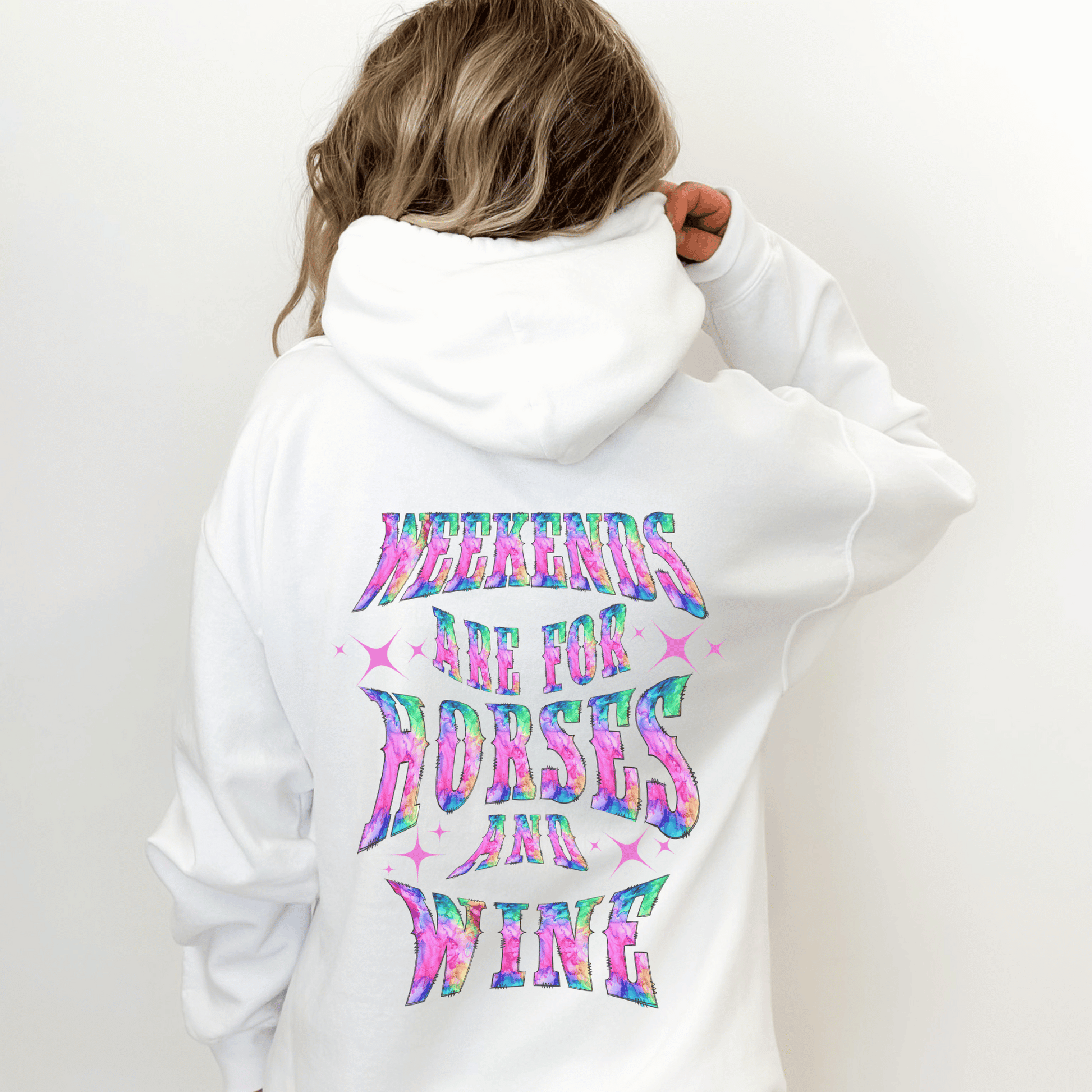 Add a touch of fun to your wardrobe with our horse girl hoodie! With a playful design on the back and tie-dye lettering, this shirt is perfect for casual outings or days spent at the barn. The "Weekends Are for Horses and Wine" message is sure to put a smile on everyone's face, and the comfortable fit ensures that you'll want to wear it all day long. If you are looking for the oversized baggy fit please size up. They run true to size.