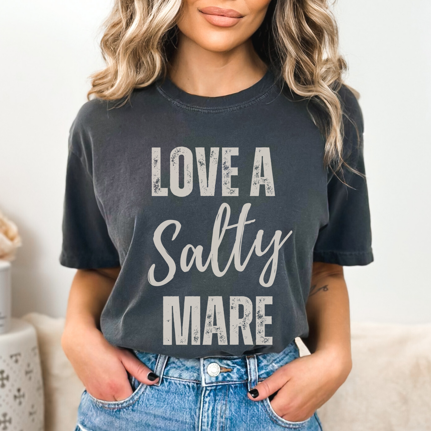 graphic tee with the saying love a salty Mare in a vintage font printed on a comfort colors tee.