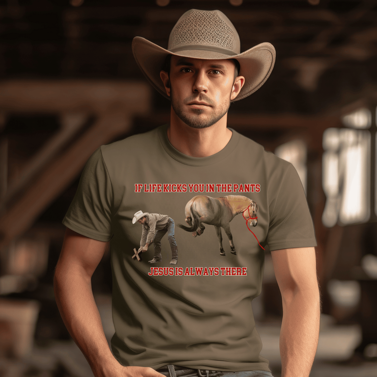 Crew Neck western t-shirt, If Life kicks you in the pants Jesus is always there. with the picture of a cowboy bending over holding a cross getting kicked by a horse.