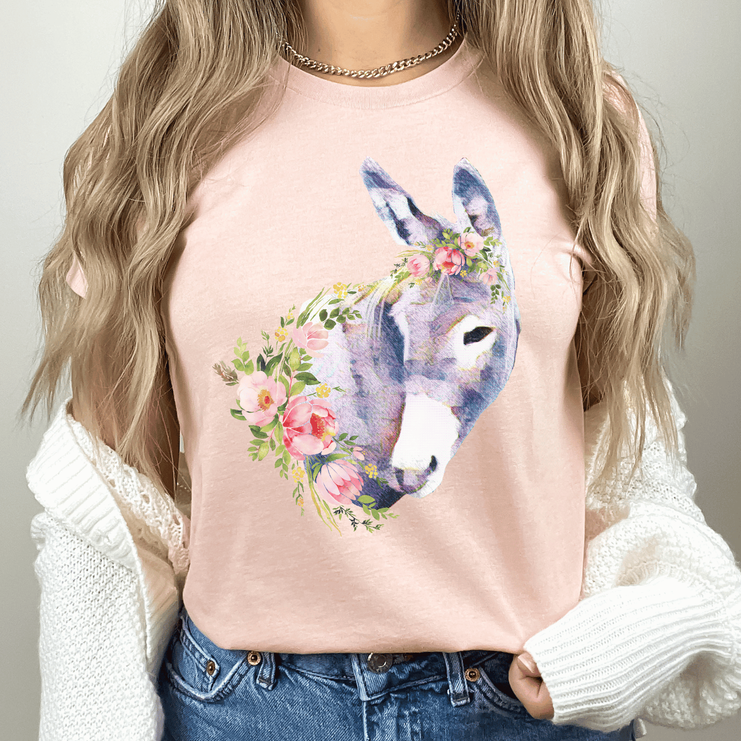 A pastel donkey and flowers design on a crew neck t-shirt.