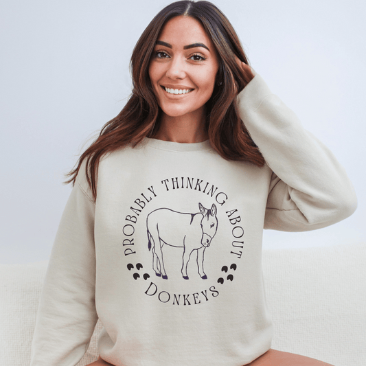 Probalby thinking about Donkeys with a cute outline of a donkey on a crewneck sweatshirt.