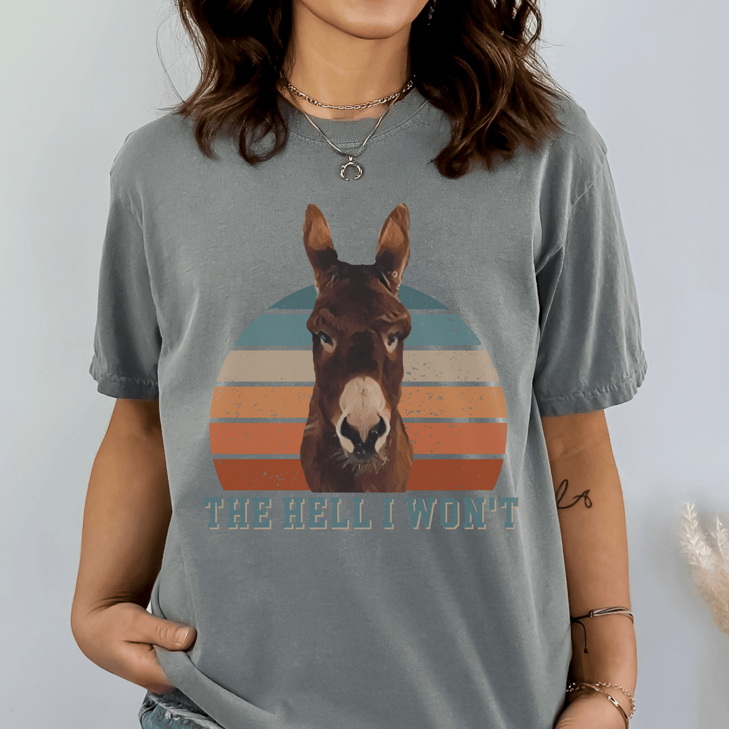  Cute Donkey t-shirt, designed for those who love a touch of sass! Featuring the saying Hell I won't below a sassy donkey, this shirt is perfect for expressing your bold and confident personality. Made from premium quality materials, this t-shirt is not only stylish but also comfortable to wear.