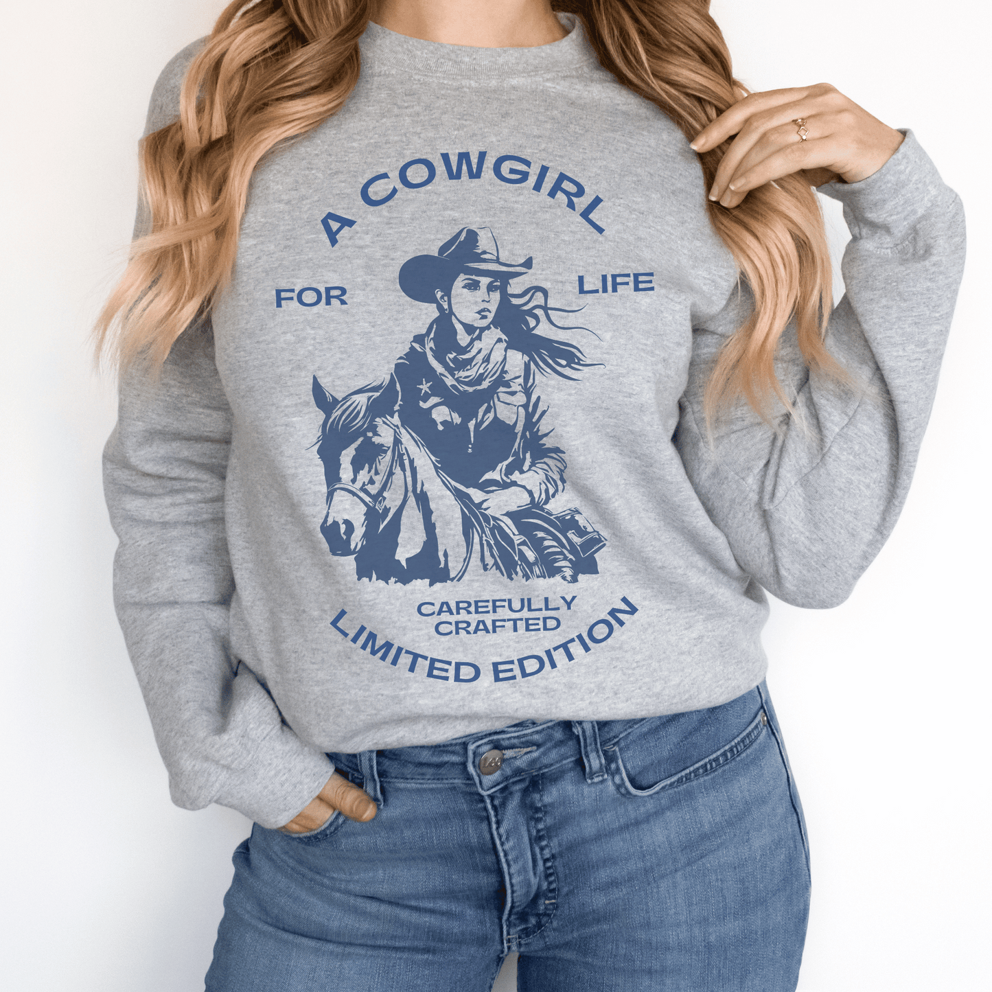 versatile sweatshirt features a bold and empowering statement that showcases your love for the cowgirl lifestyle. Whether you're out on the ranch, riding your favorite horse, or simply rocking a casual yet chic look, this sweatshirt is a must-have addition to your wardrobe.