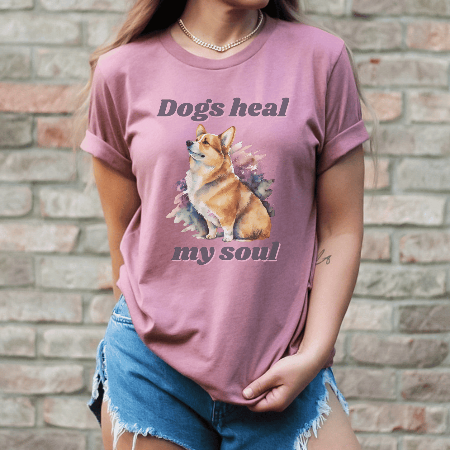 The "Dogs Heal My Soul" t-shirt features a cute corgi dog design, making it a perfect gift for any dog Momma who loves corgis. It is a unique and thoughtful gift that is sure to be appreciated.