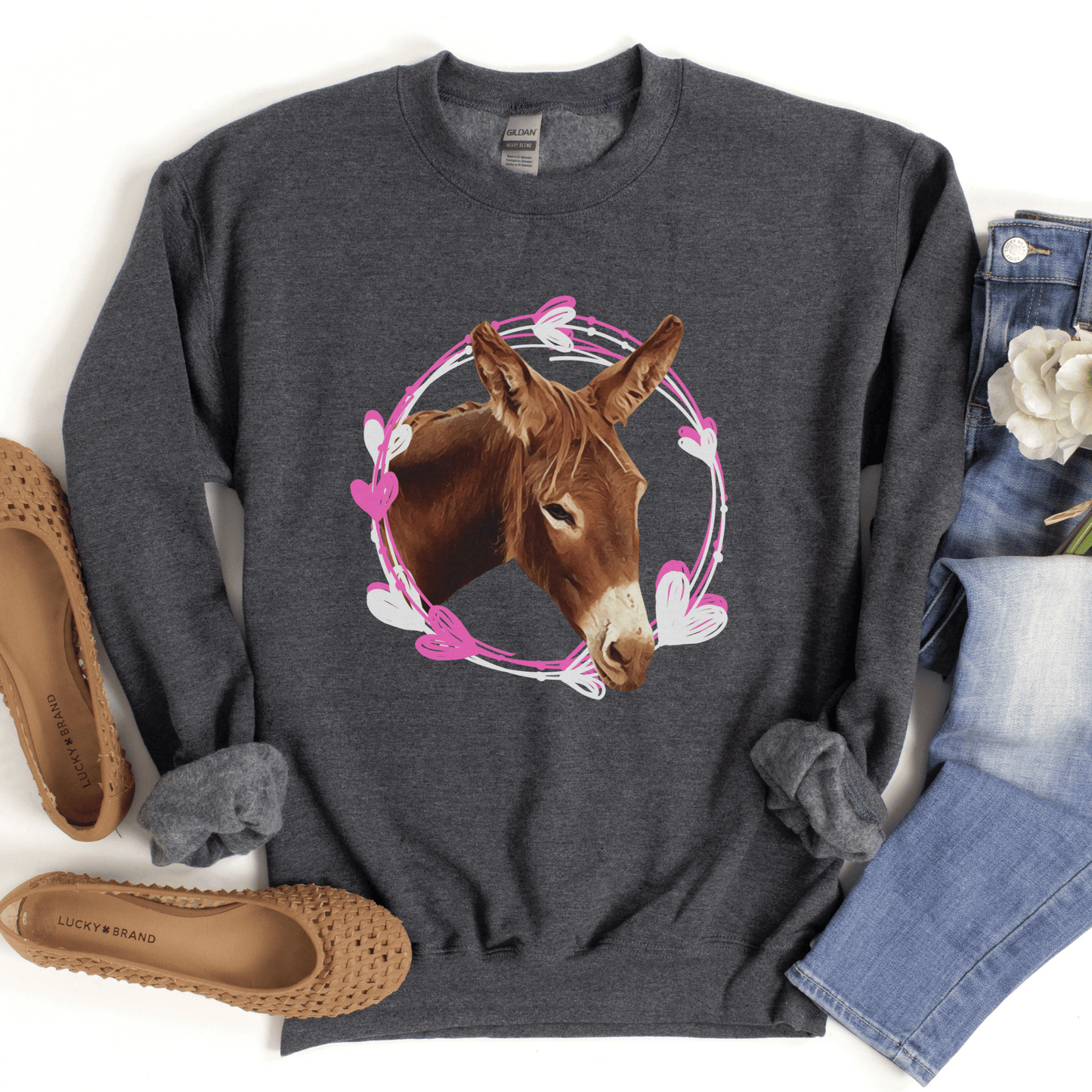 Adorable Donkey heart wreath crew neck, designed to showcase your love for donkeys! Whether you want to express your affection for these gentle creatures, this cute and cozy sweatshirt is the perfect choice. Crafted with the soft materials, you'll love how snugly warm and comfortable it feels against your skin