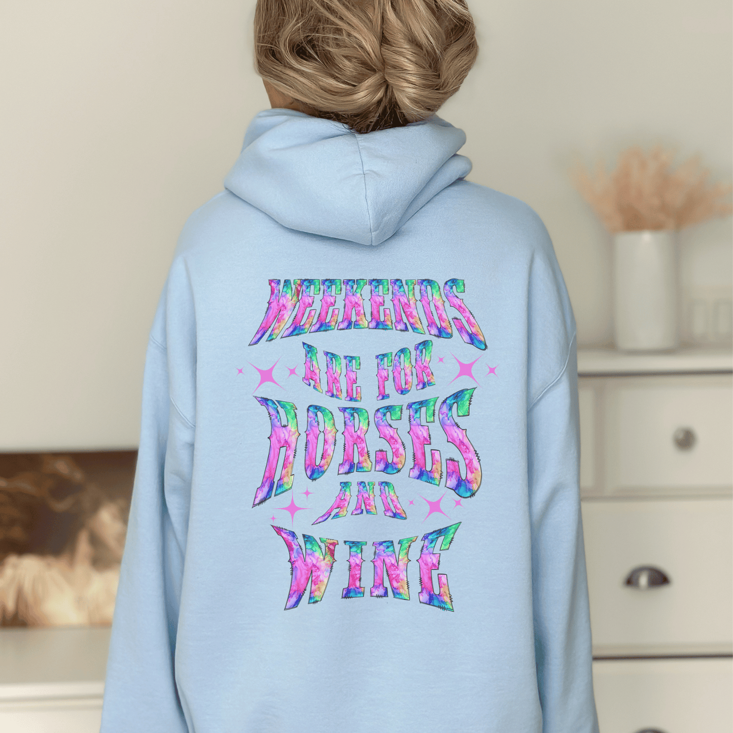 Add a touch of fun to your wardrobe with our horse girl hoodie! With a playful design on the back and tie-dye lettering, this shirt is perfect for casual outings or days spent at the barn. The "Weekends Are for Horses and Wine" message is sure to put a smile on everyone's face, and the comfortable fit ensures that you'll want to wear it all day long. If you are looking for the oversized baggy fit please size up. They run true to size.