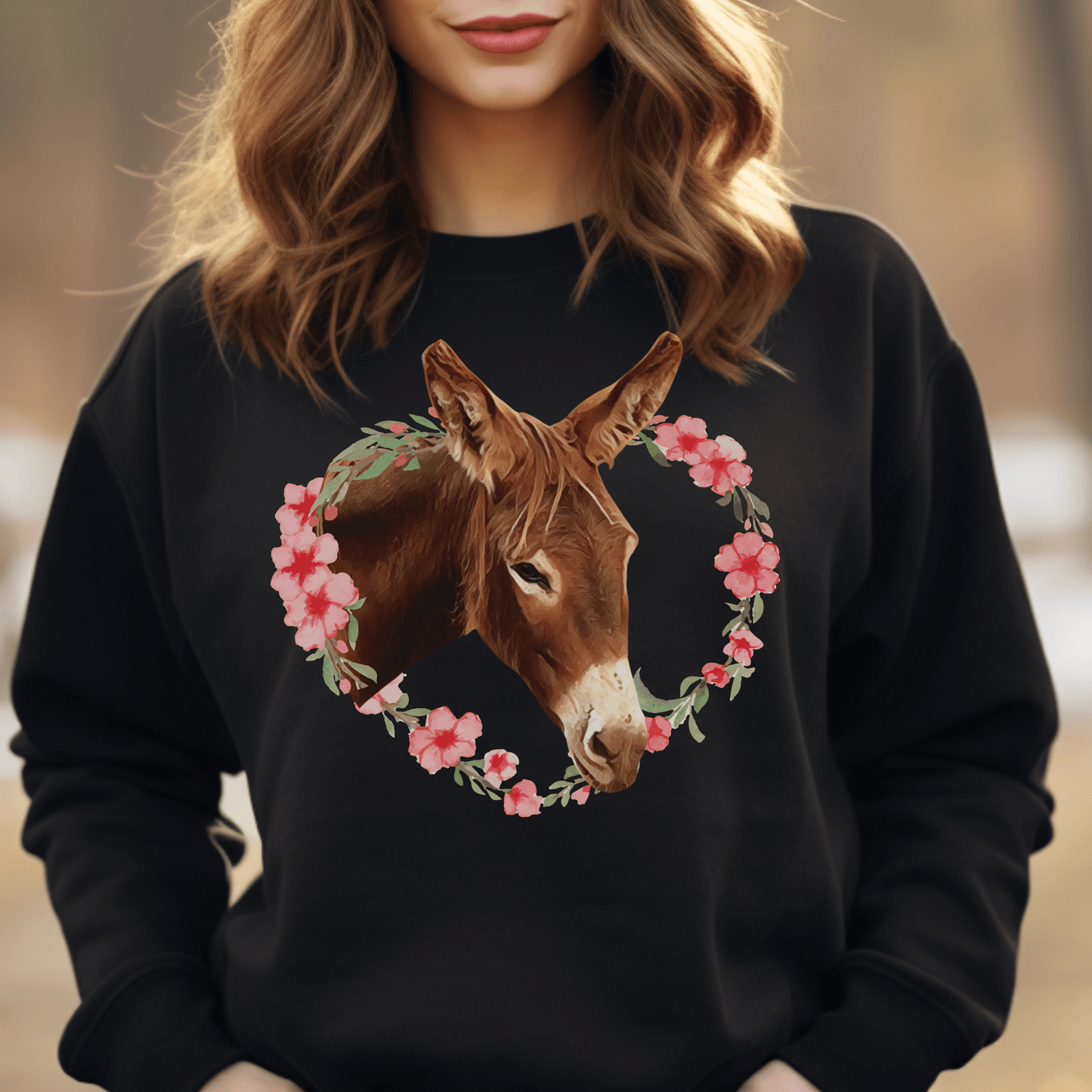 Crew neck sweatshirt with a cute donkey  surrounded by a pink flower wreath.