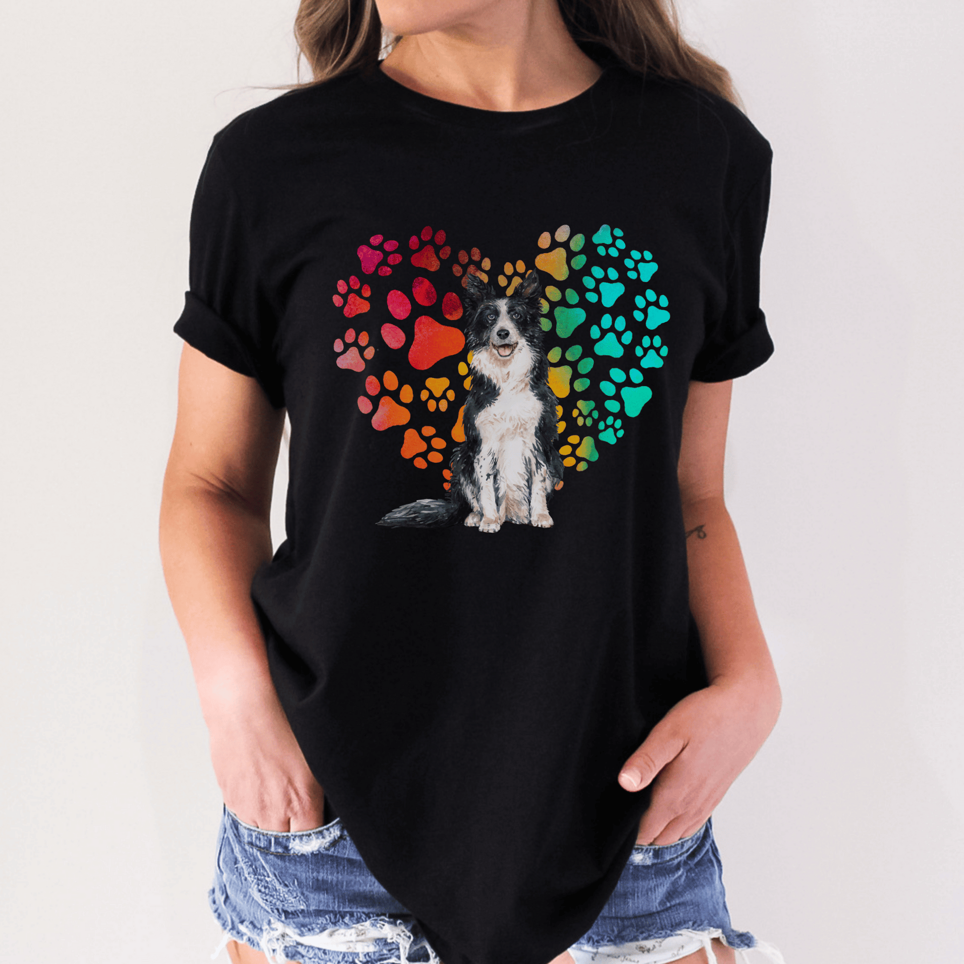 This Border Collie Dog t-shirt features a paw print heart in the background, making it a unique and thoughtful gift for dog lovers, pet owners, and Border Collie moms. The shirt is perfect for anyone who wants to show off their love for their furry friend.