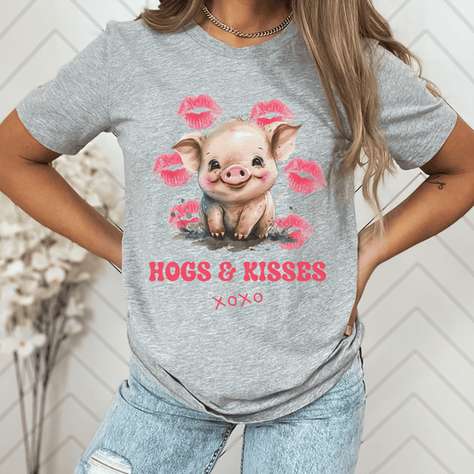 Look no further than this cute pig t-shirt that says "Hogs and Kisses". Whether you're a pig lover or just want to make a playful statement, this t-shirt is the perfect choice. Crafted from top-quality material, this shirt is both durable and comfortable, making it perfect for any occasion. So go ahead and add some fun to your wardrobe with this fun and flirty pig t-shirt.