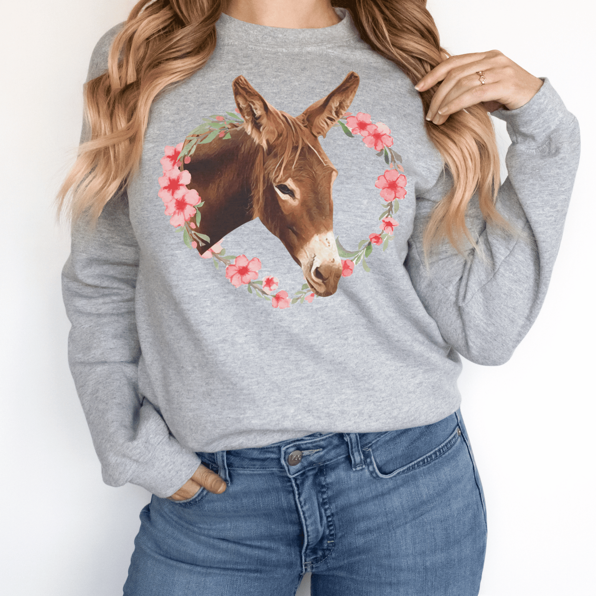 Crew neck sweatshirt with a cute donkey  surrounded by a pink flower wreath.