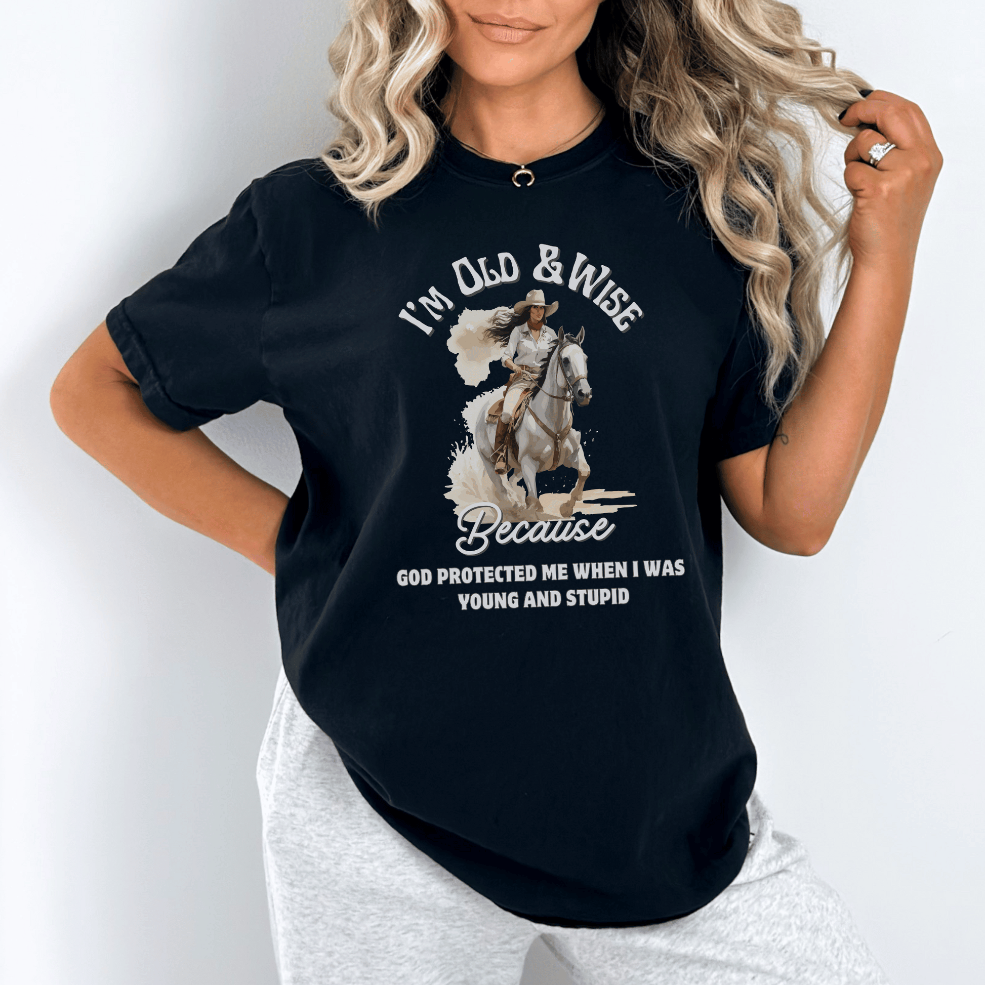 Funny t-shirt that perfectly captures the wisdom that comes with age and the protection of God! This witty shirt features the humorous phrase old and wise because God protected me when I was young and stupid.